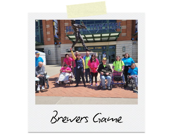 Brewers Game: 12 participants in front of the Brewers Stadium statue.