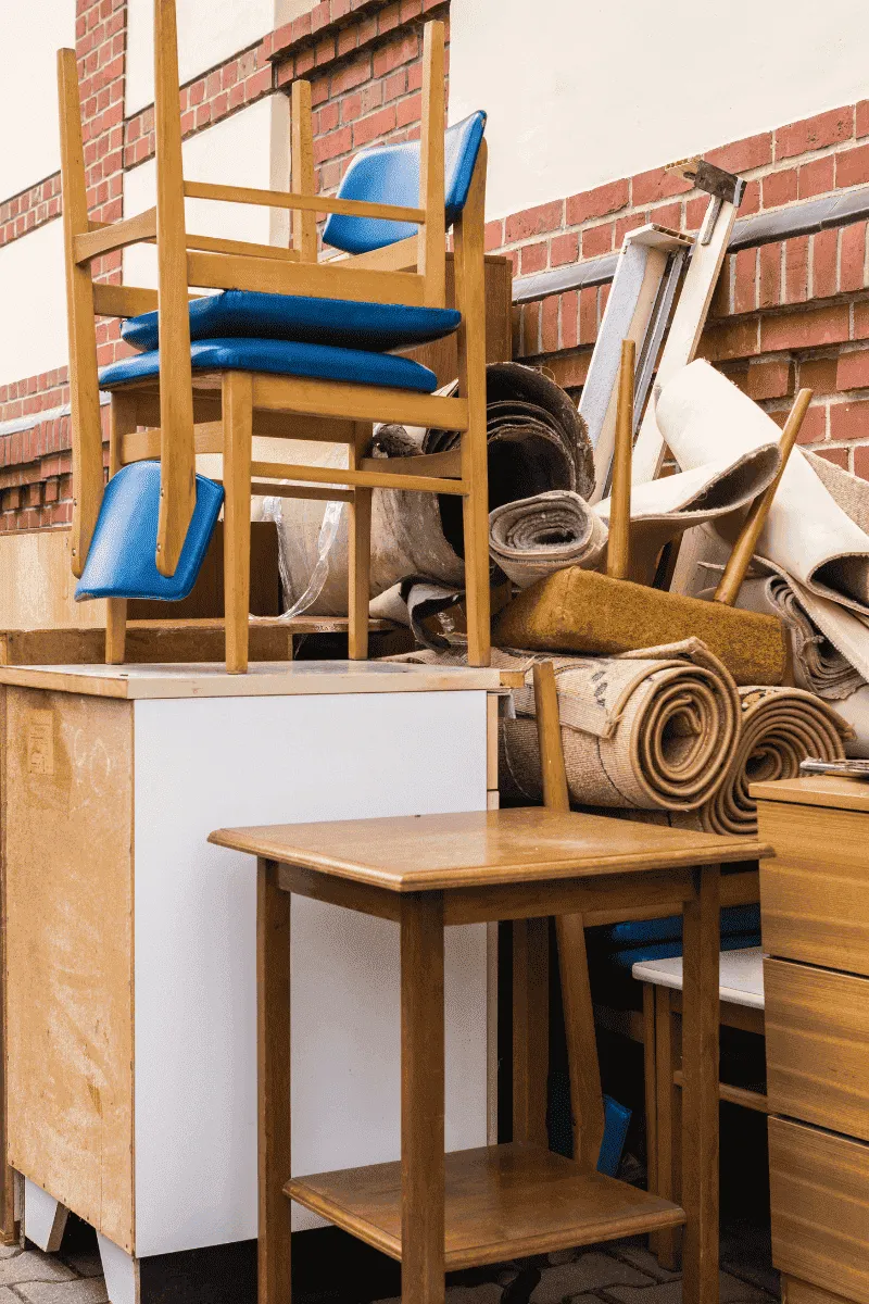 Junk sitting outsite with chairs furniture and other items in newman GA