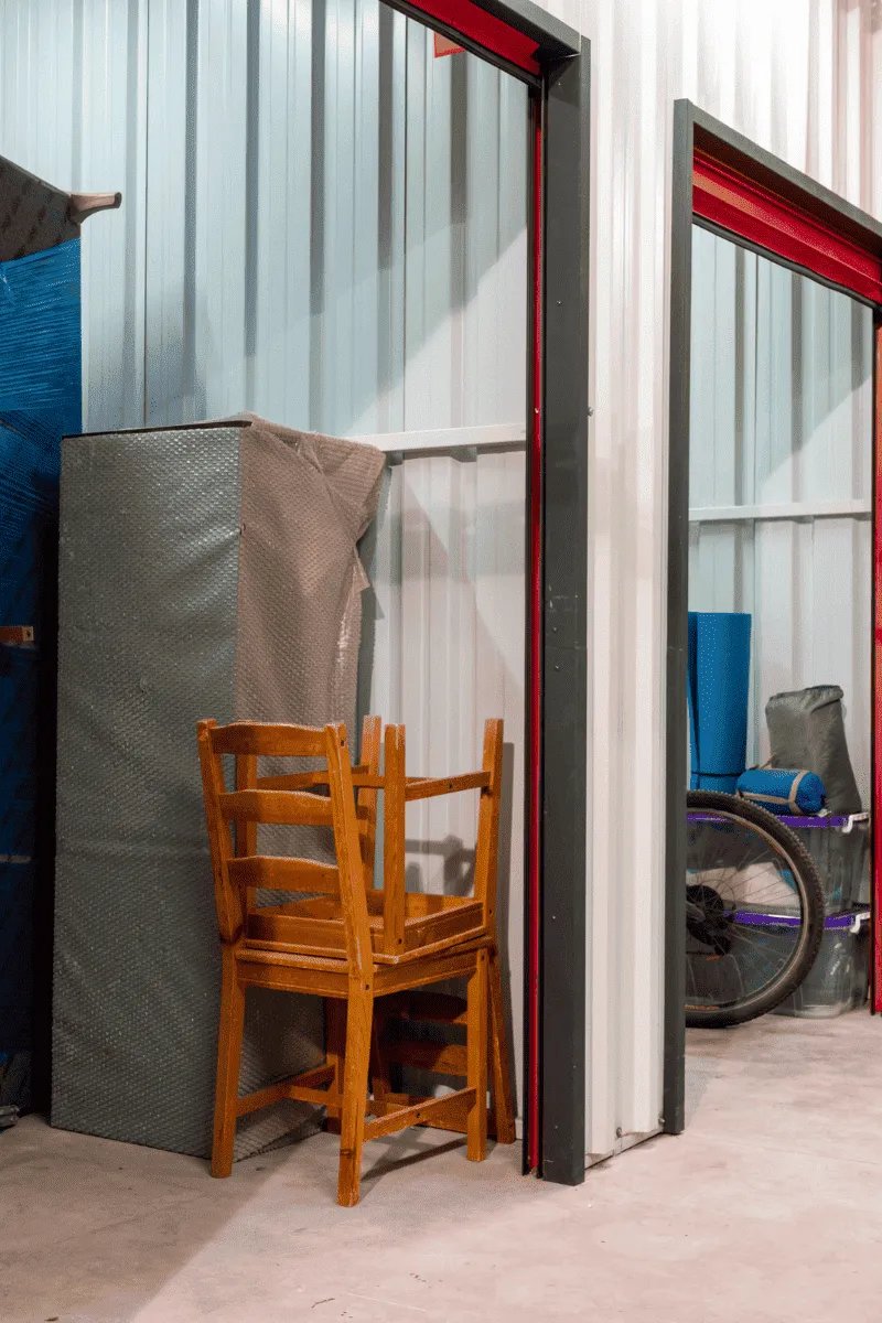 An organized storage unit being emptied out to save the customer on monthly rental fees.
