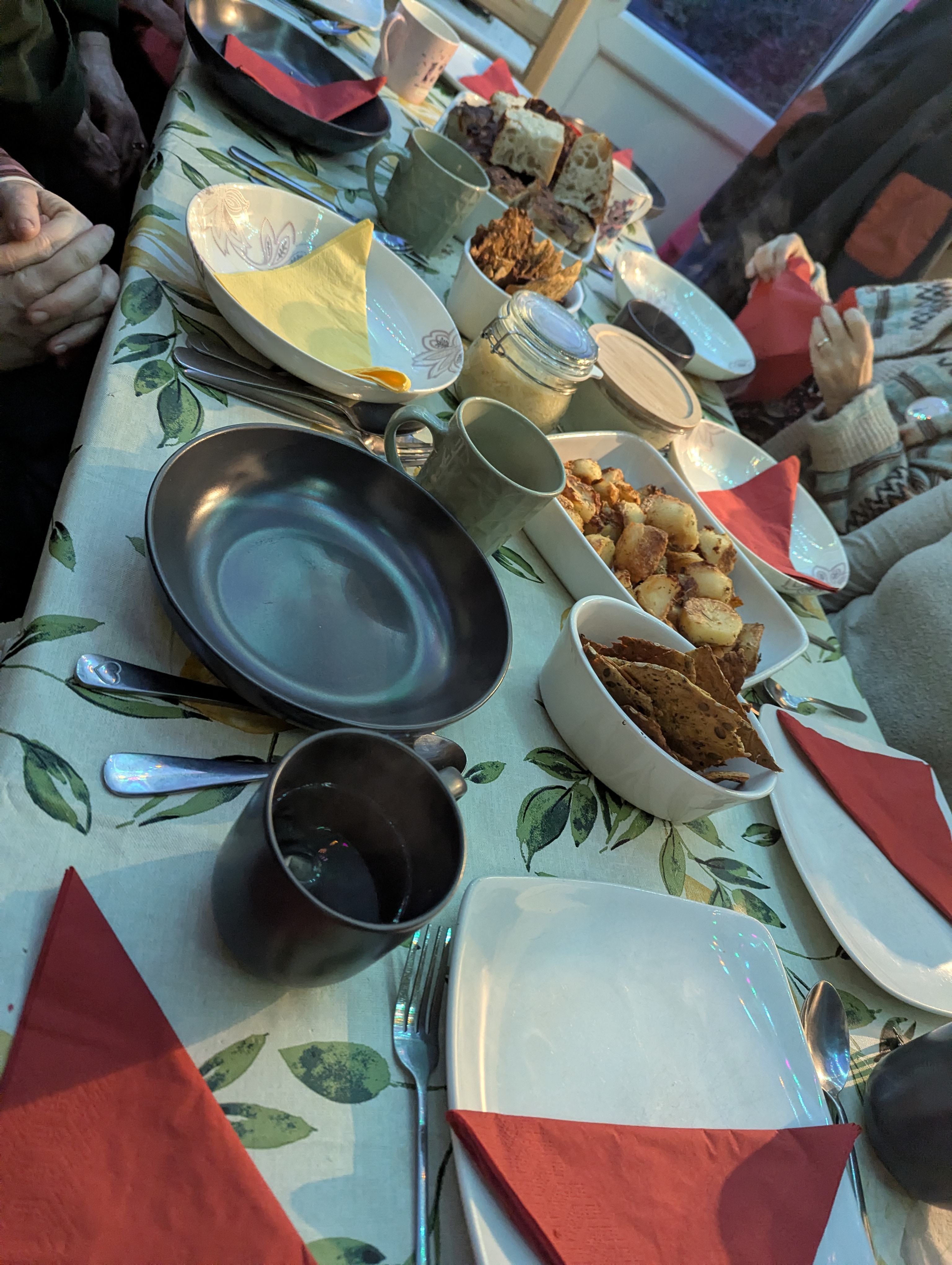 women’s supper club dinner table with shared bowls of food and rustic styling