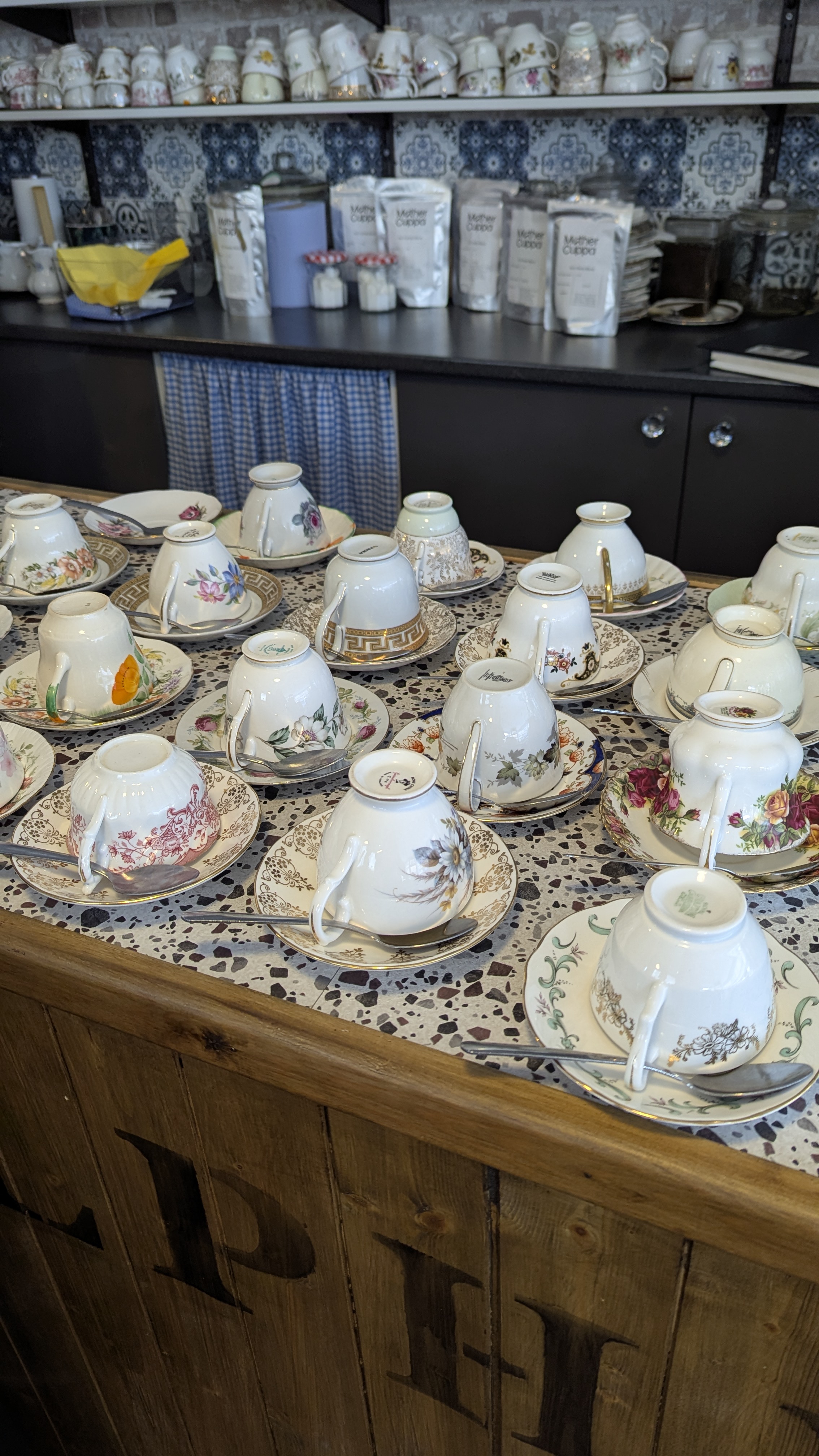 vintage tea cups in saucers on counter vintage tea cups in saucers on counter