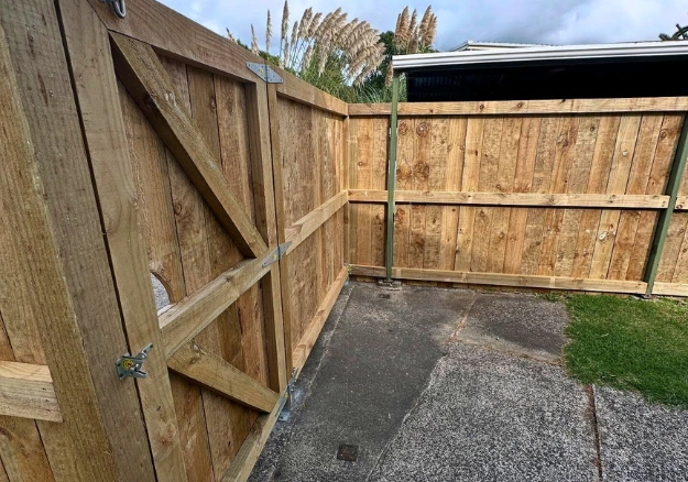 Timber boundary fence built by Legacy Construction Northland for a residential property.