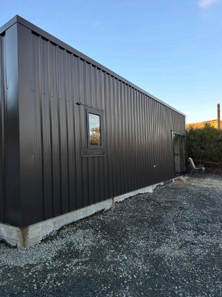 Timber-framed pole shed with corrugated steel cladding built by Legacy Construction Northland.