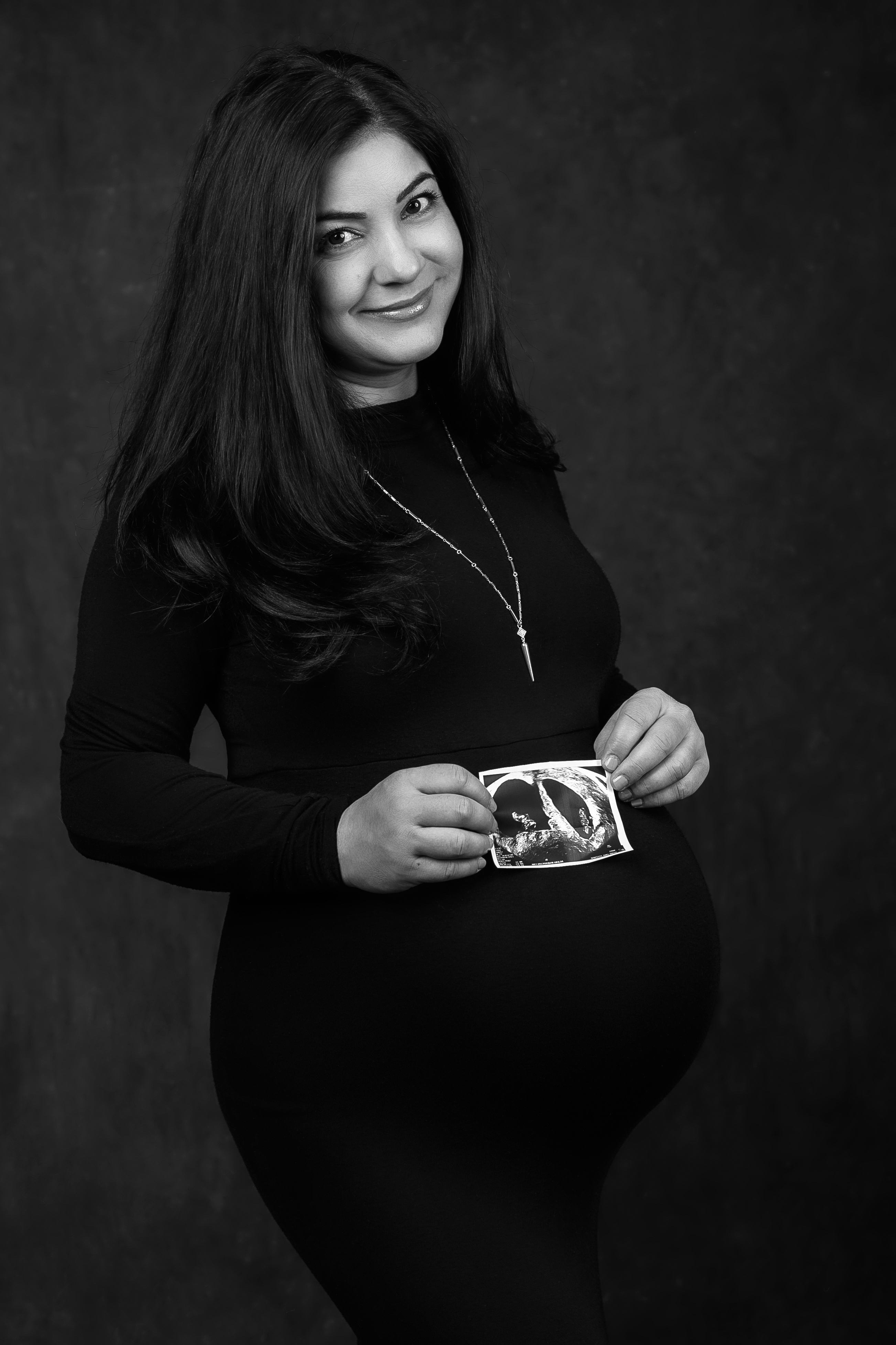 Sara holding ultrasound photo