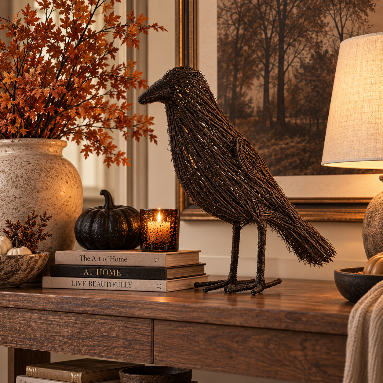 A black rattan crow on a console beside a lamp