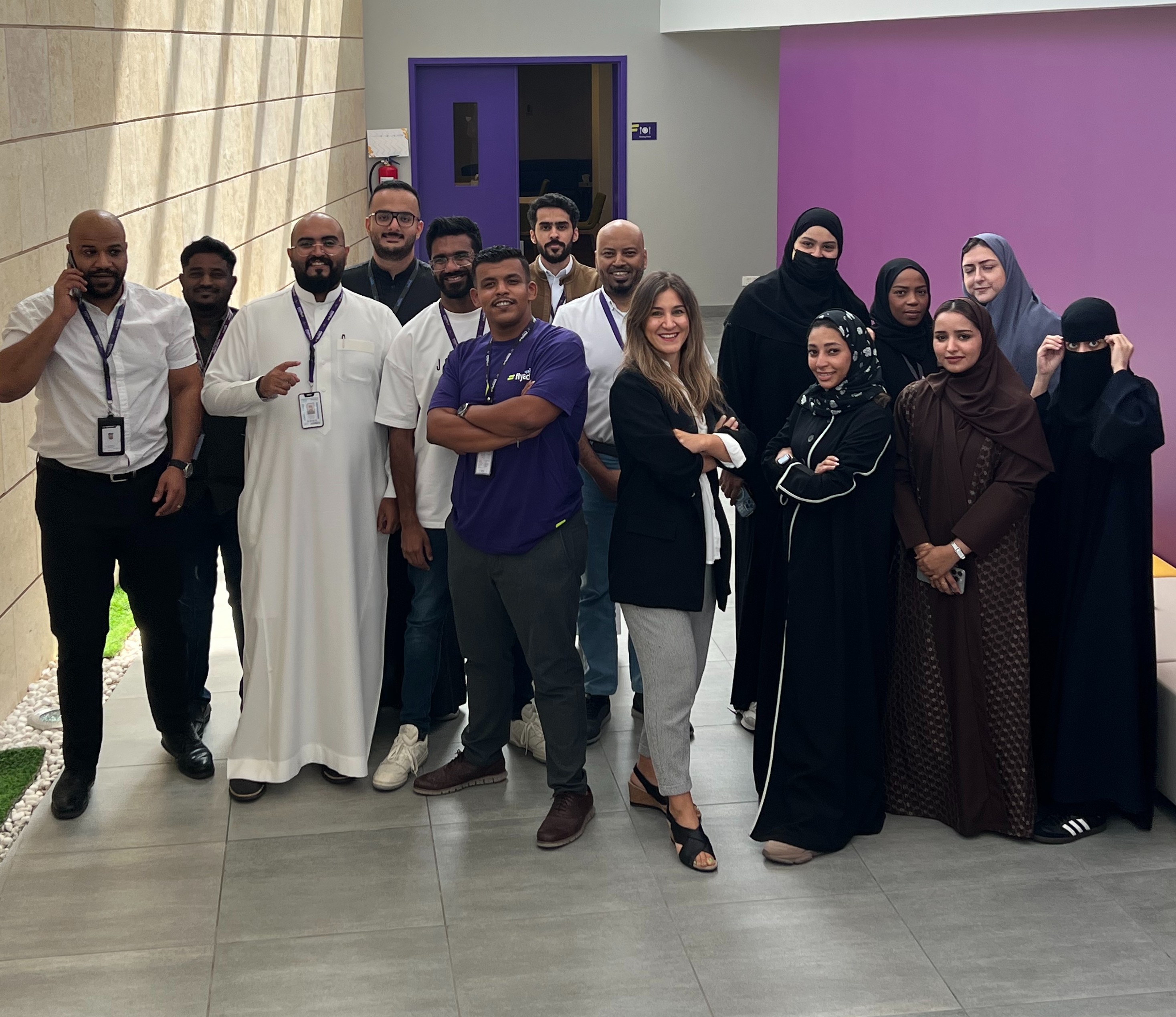 Bahar with participants at a leadership event