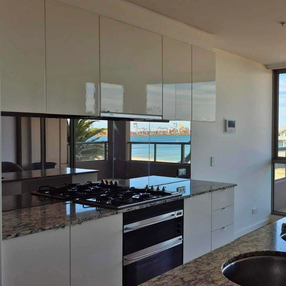 High-quality mirror splashbacks for Melbourne kitchens by Coloured Glass Solutions