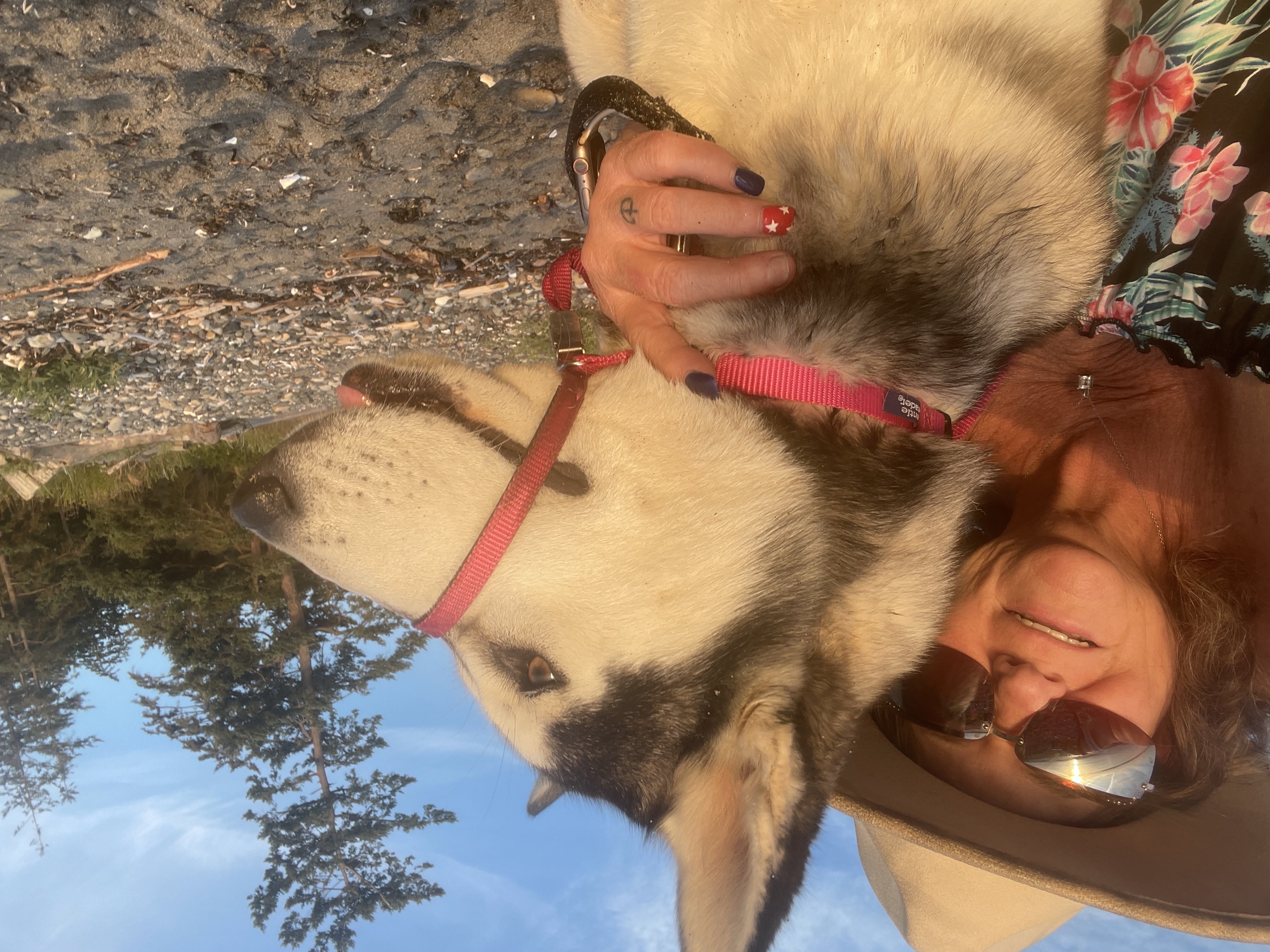 Woman in a cowboy hat with her husky