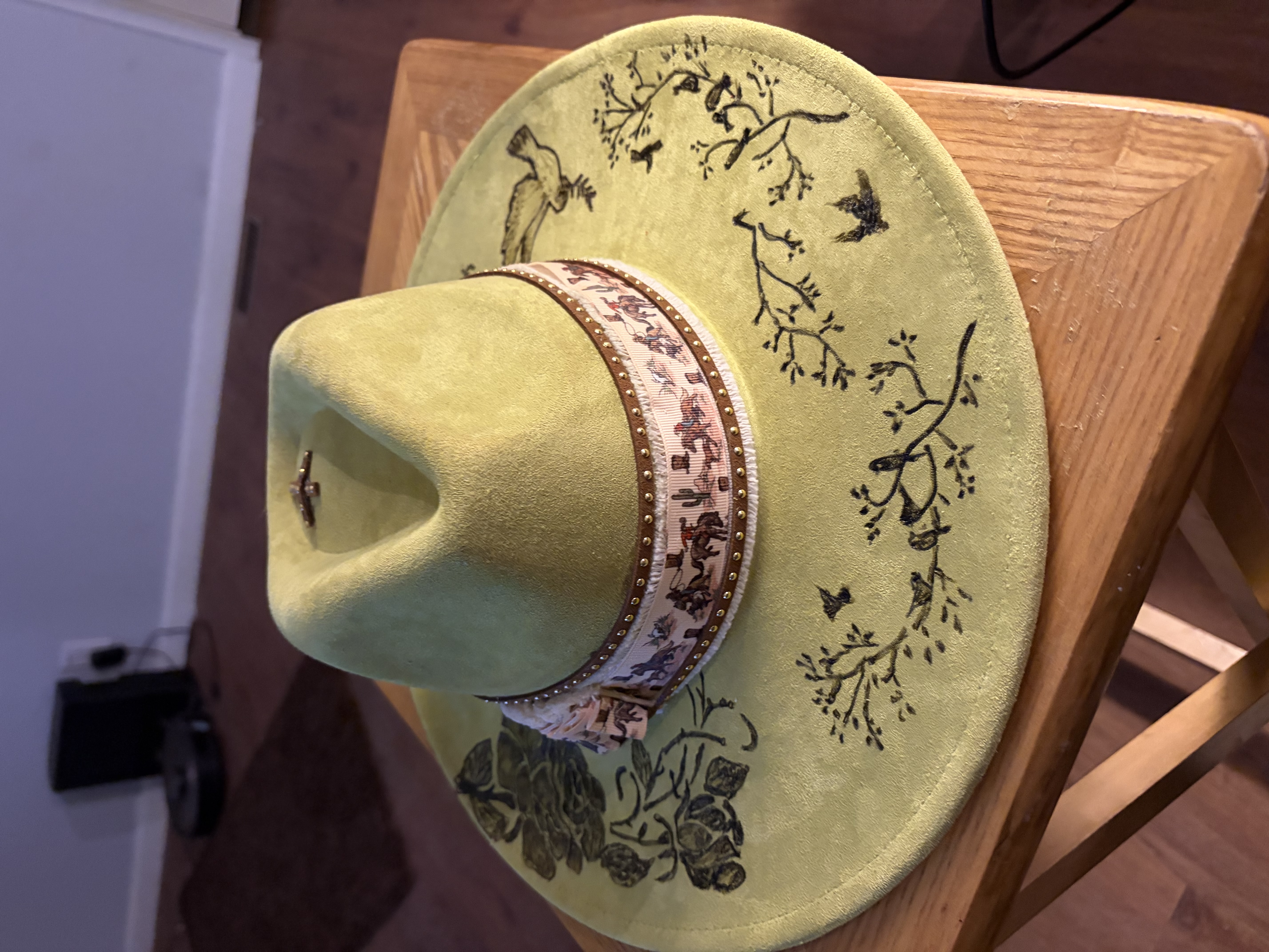 Custom green hat with a hand-detailed band