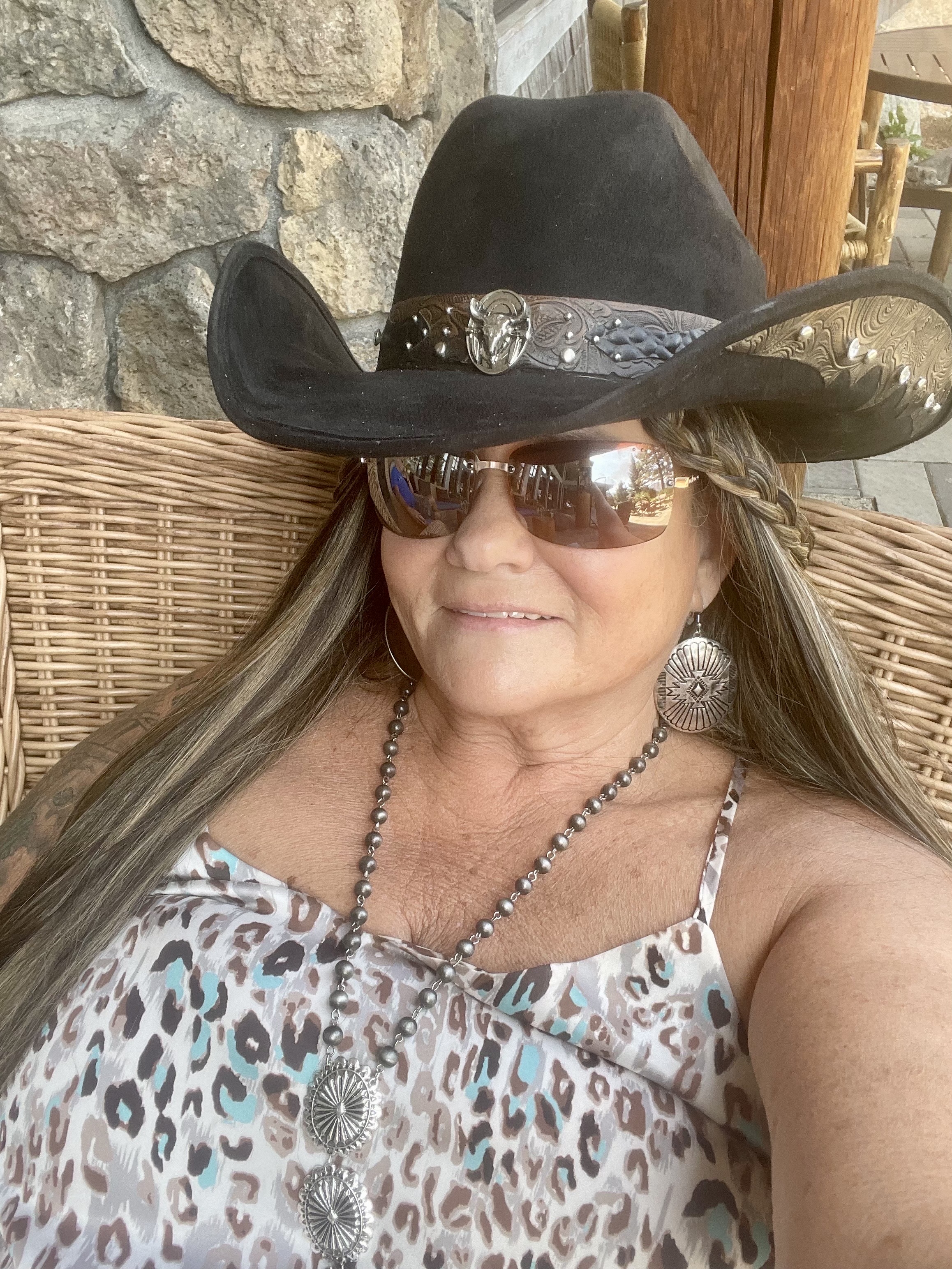 Dark felt hat worn on the porch