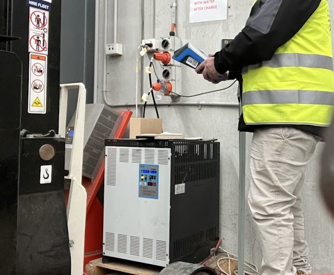 Workers in hi-vis safety gear on a Melbourne construction site requiring RCD testing