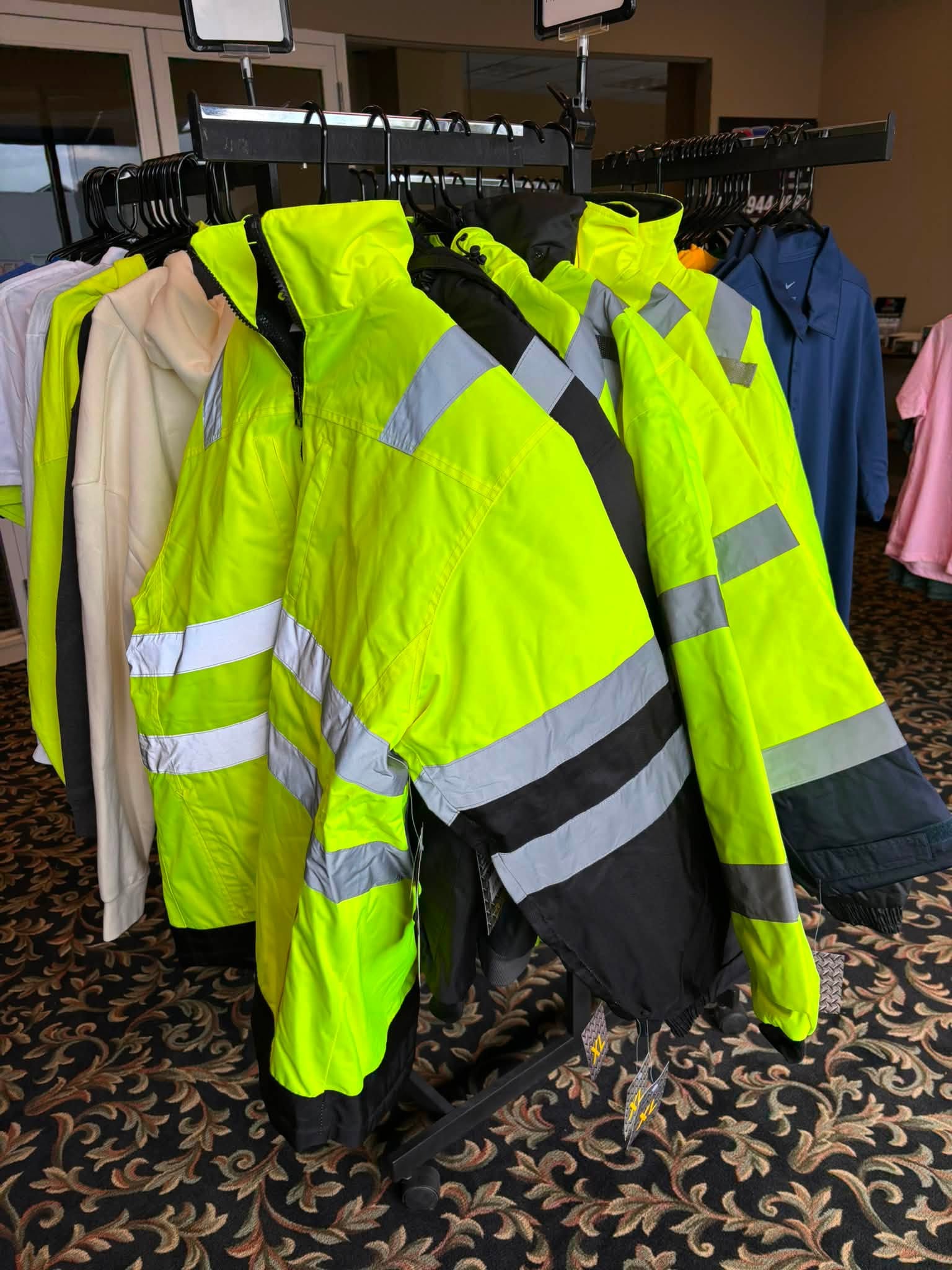 High-visibility workwear and safety jackets displayed at RD Graphics & Design in Rotterdam, NY