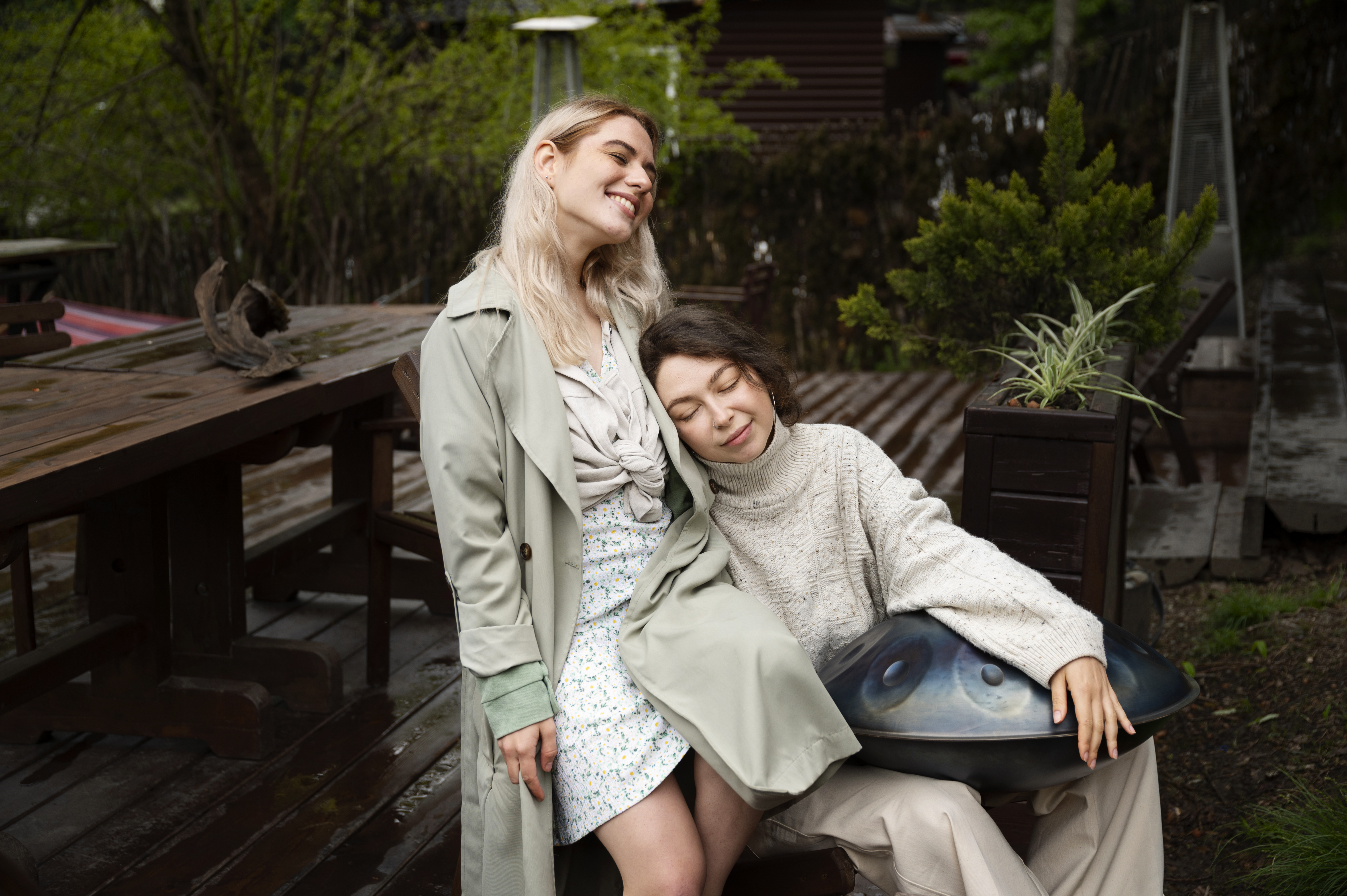 lesbian lovers sitting outdoors in the woods