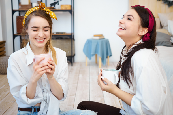 lesbian lovers drinking coffee together