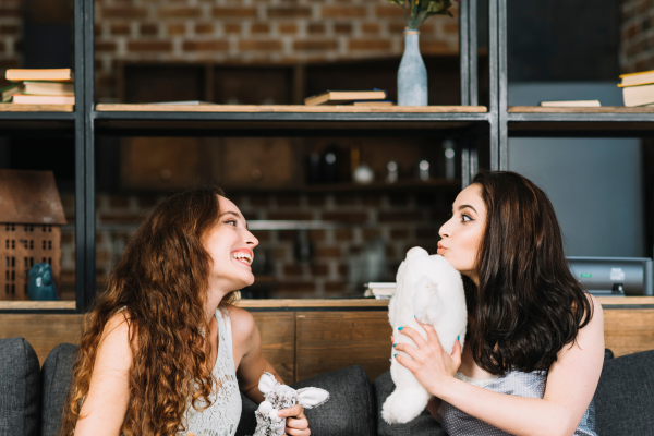 lesbian couple giggling with one another