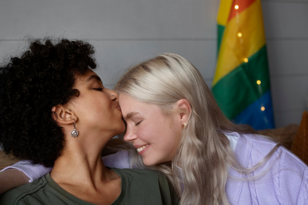 lesbian lovers on a bench in a park
