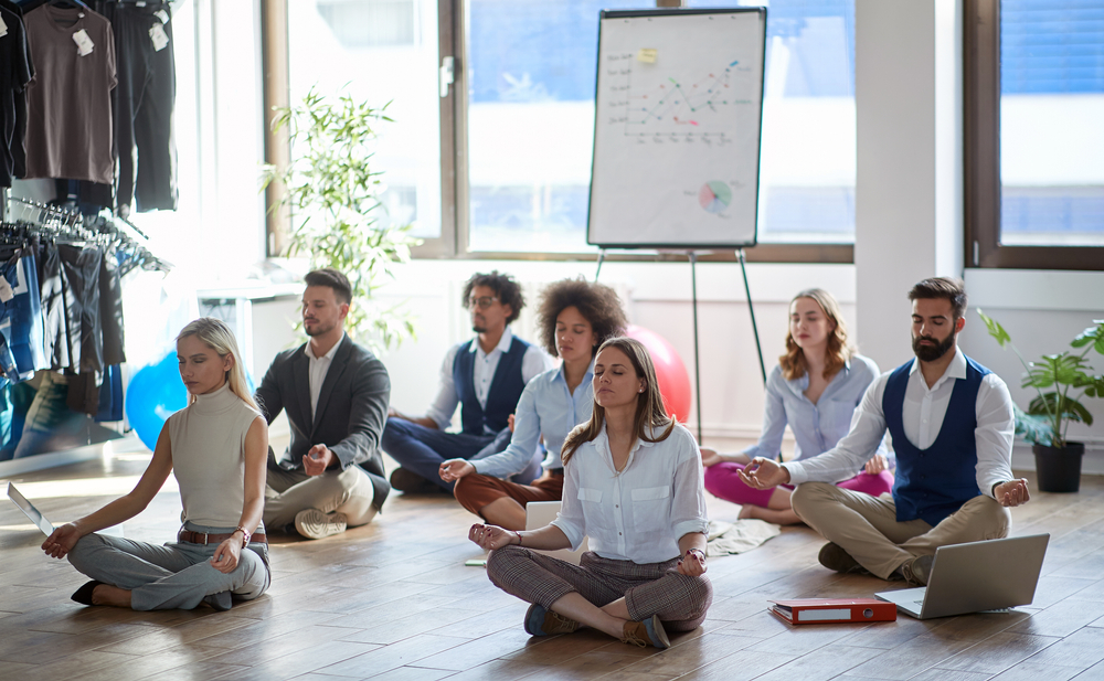Team practicing meditation together in a Dallas office