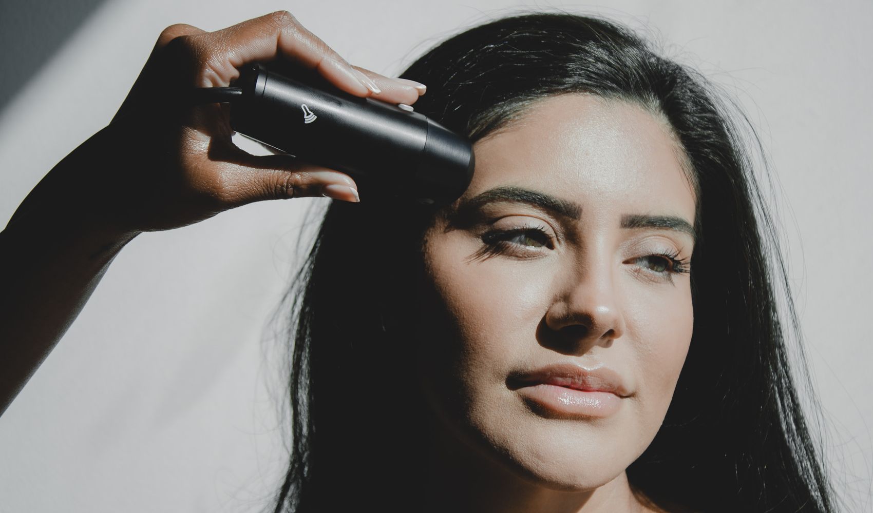 An ultrasound probe held against the forehead