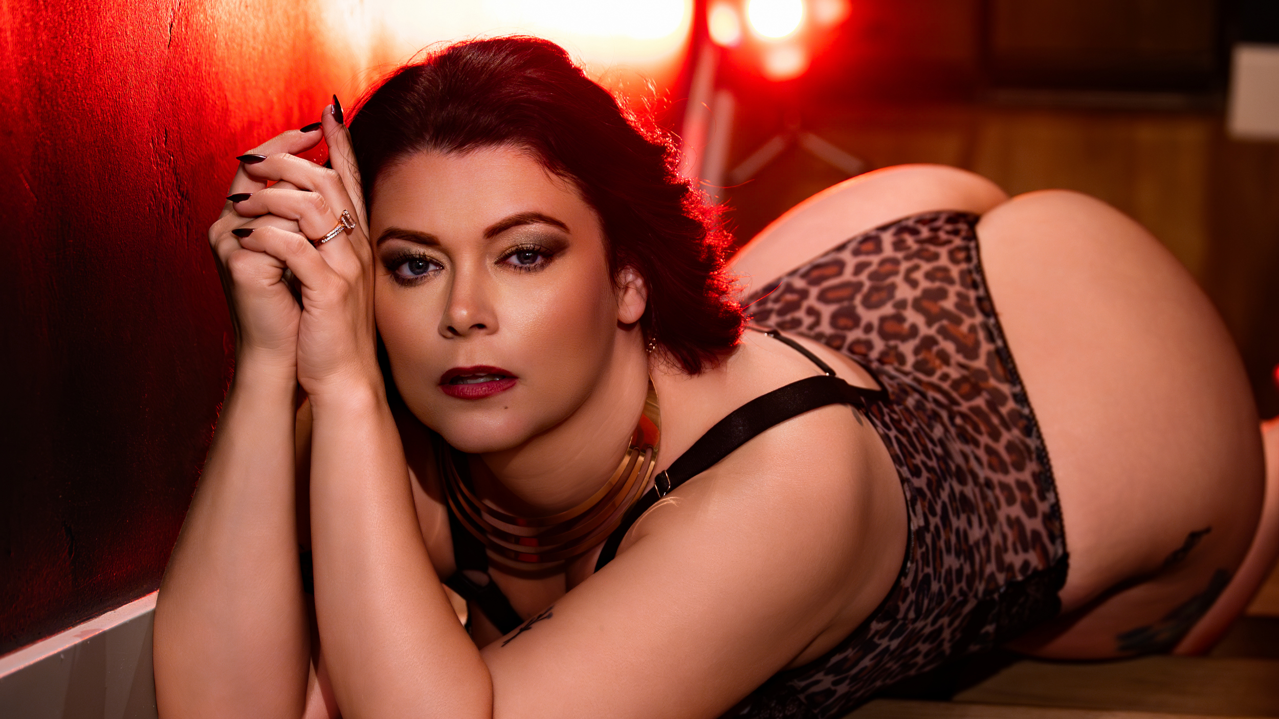 boudoir image with woman in leopard lingerie
