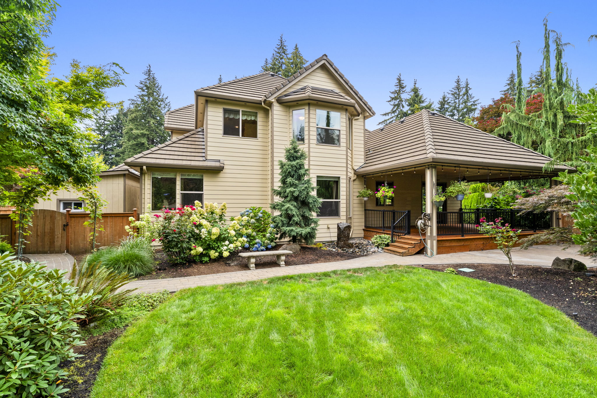 Landscaped backyard and home exterior in daylight