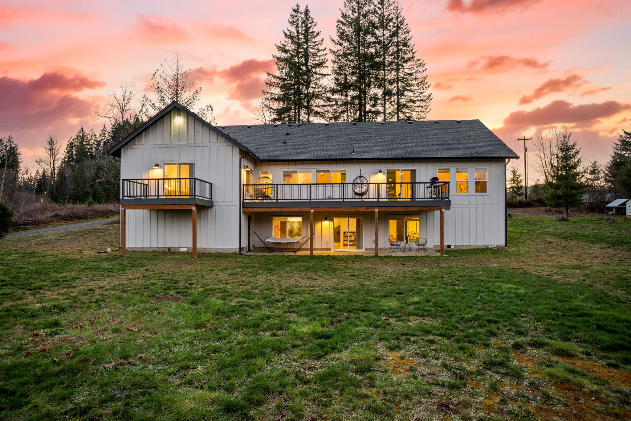 Rear exterior beneath a dramatic pink sunset
