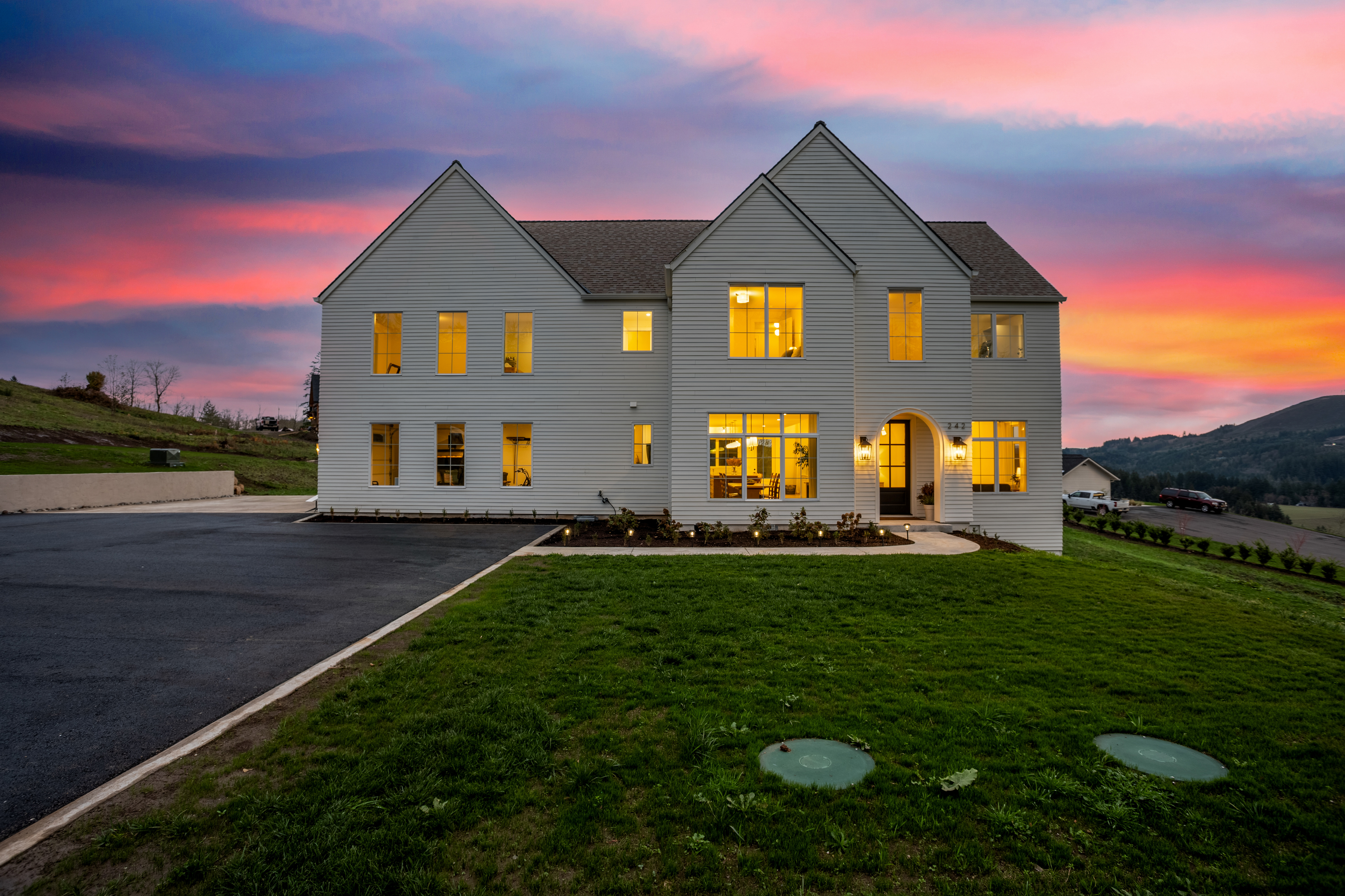 White home illuminated at sunset