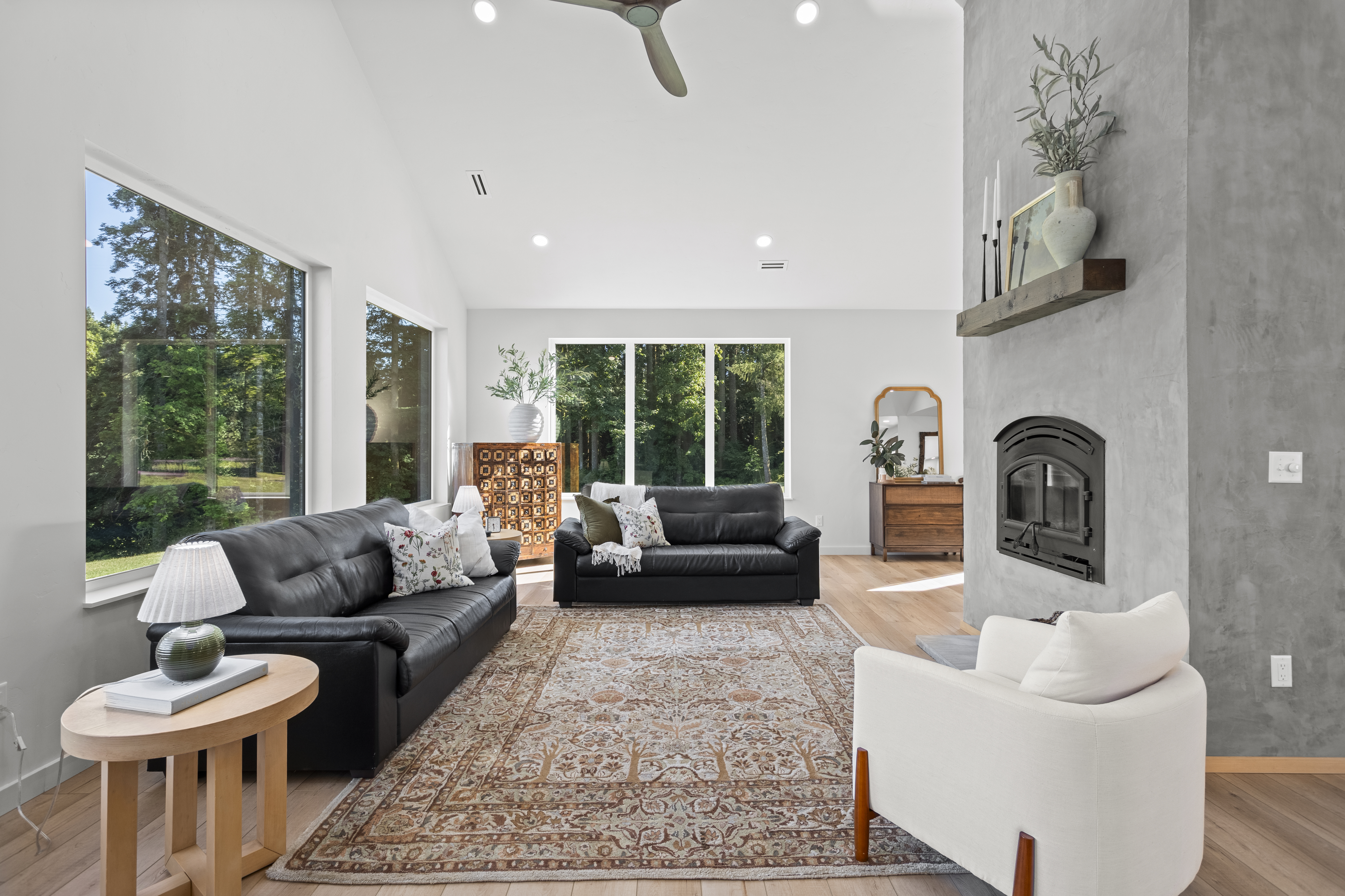 Living room with expansive windows and fireplace