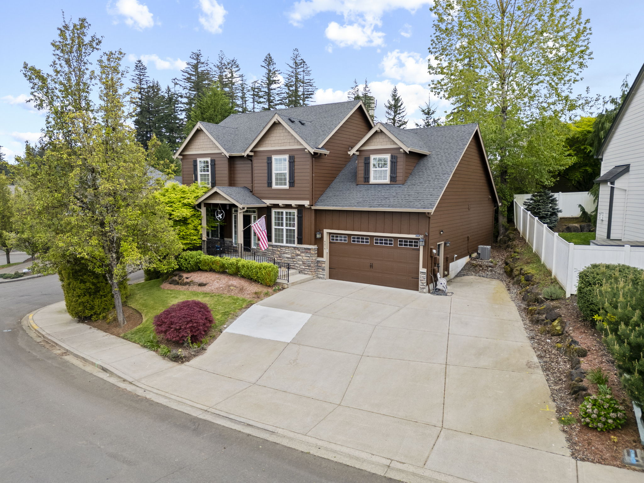 Angled aerial view of a home on a corner lot
