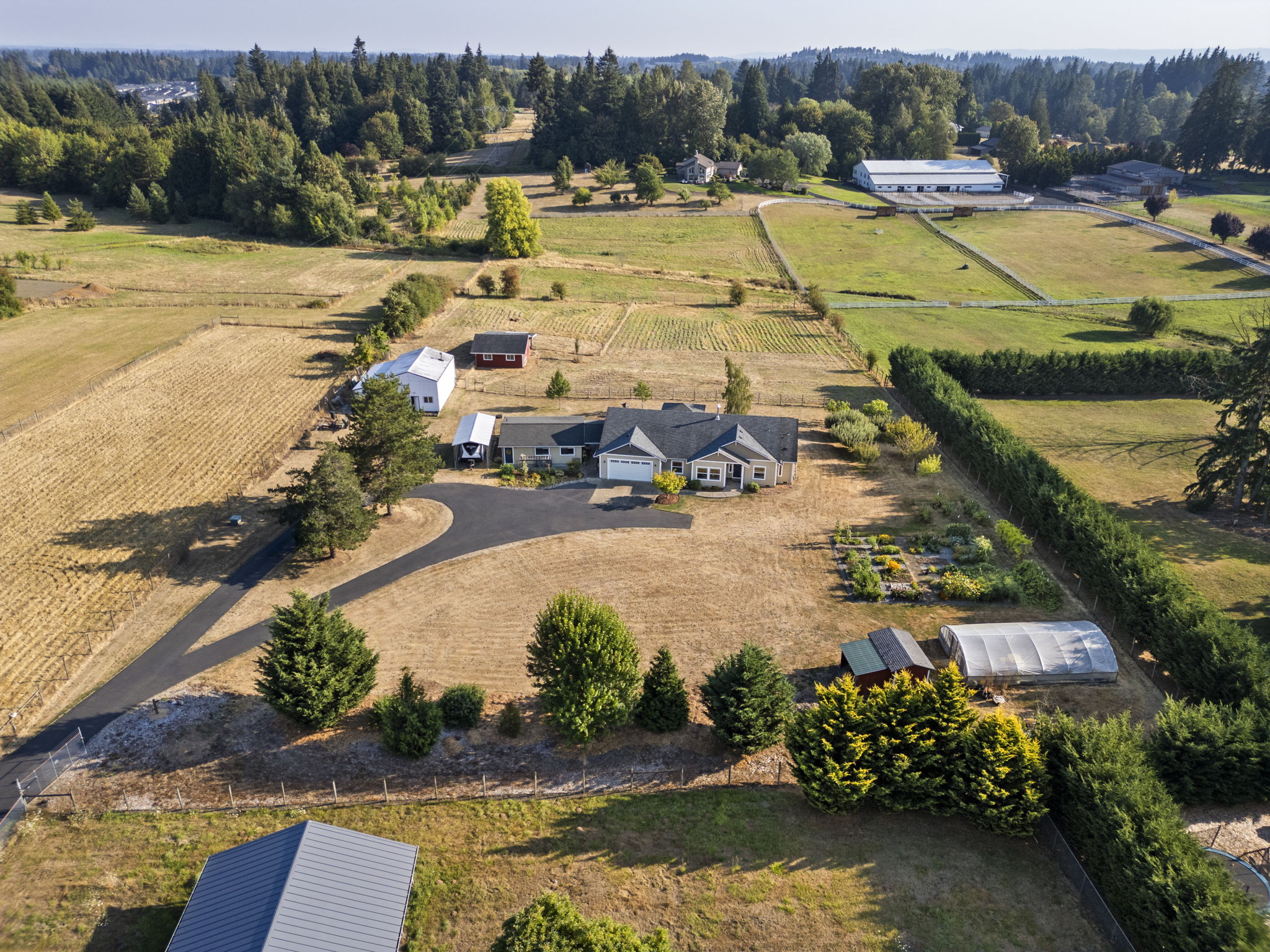 Aerial view of a home and surrounding acreage