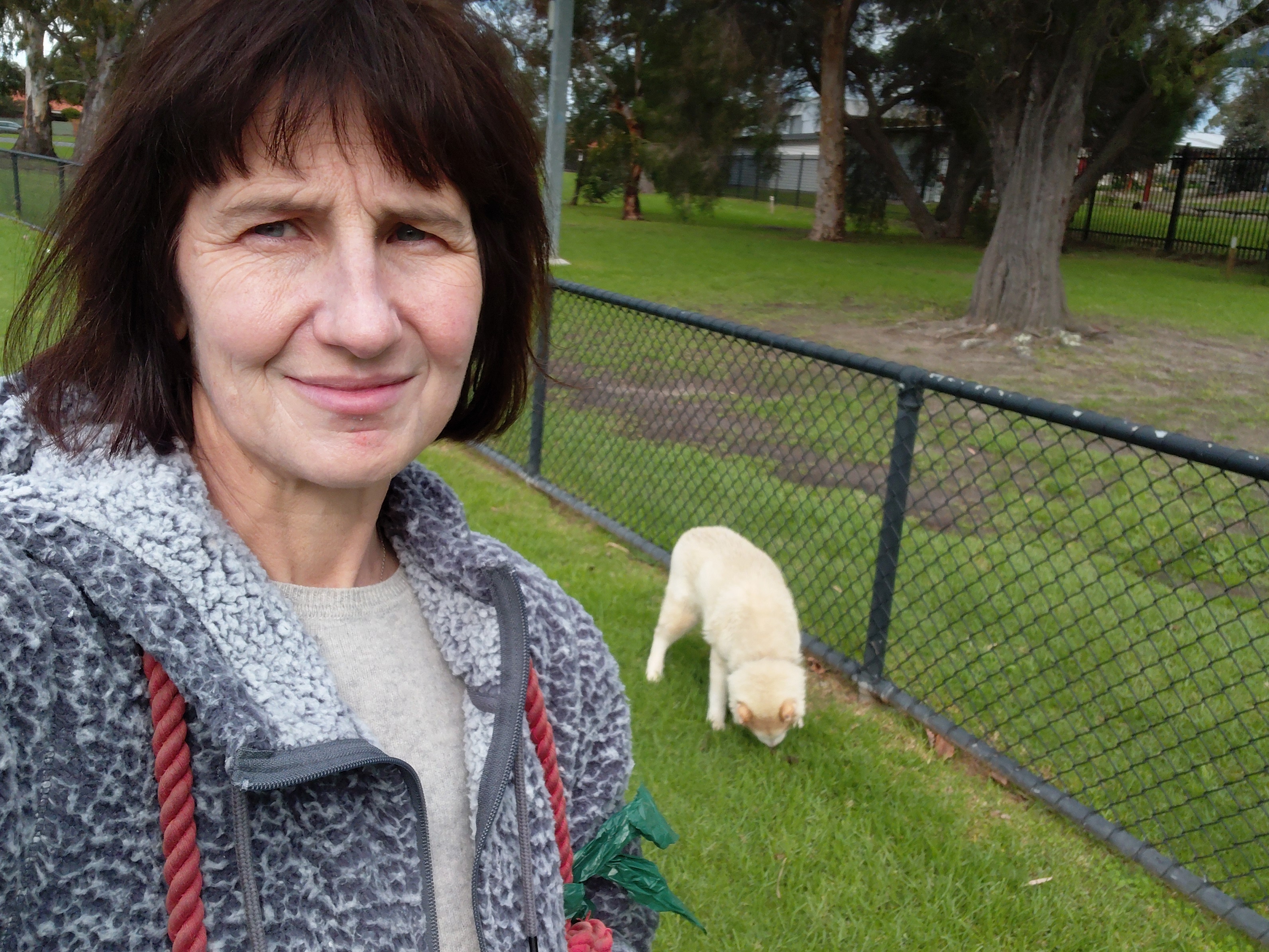 Dana at the park with a dog