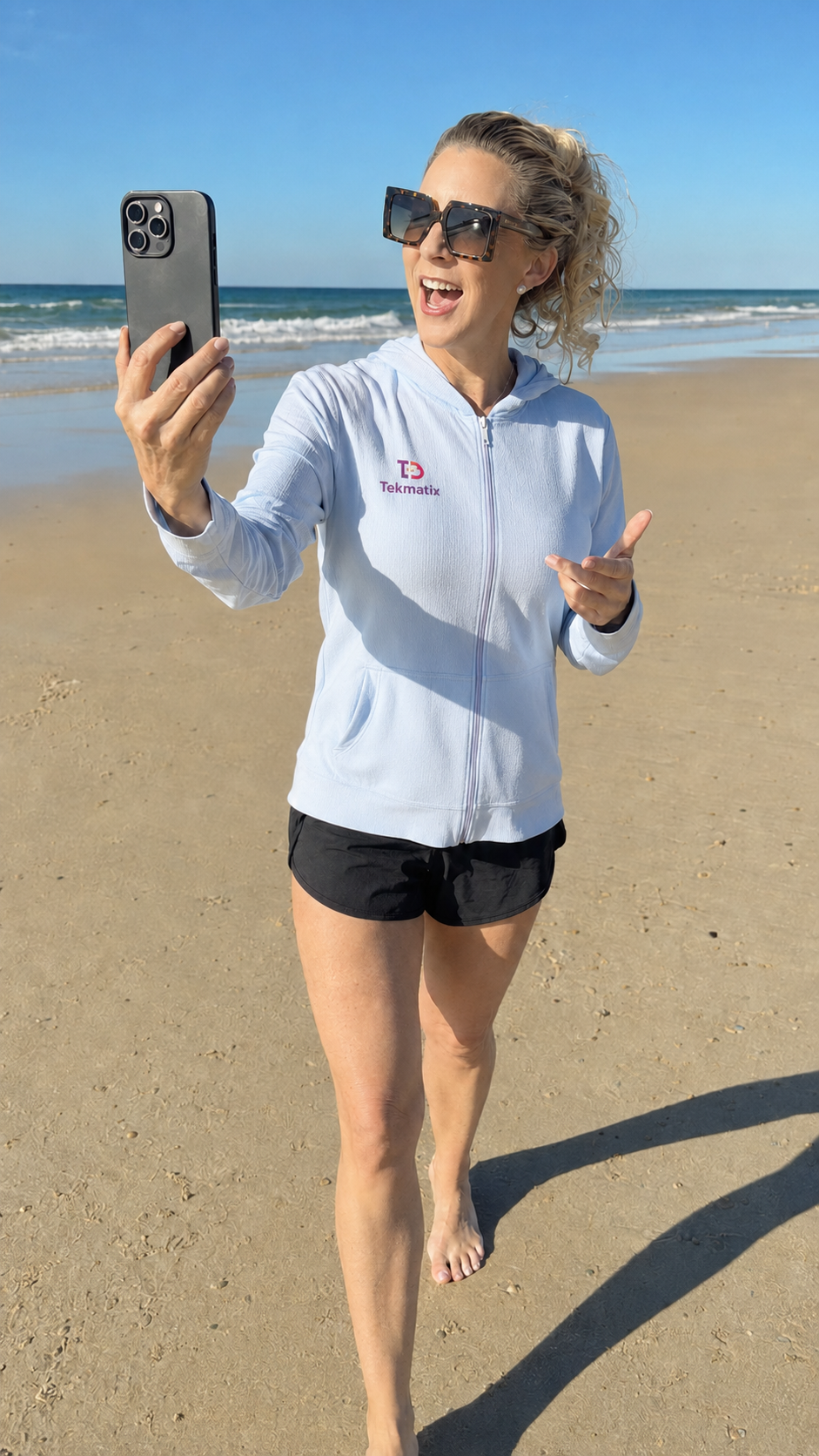Sarah Cordiner filming on the beach — Walk & Talk Video Challenge