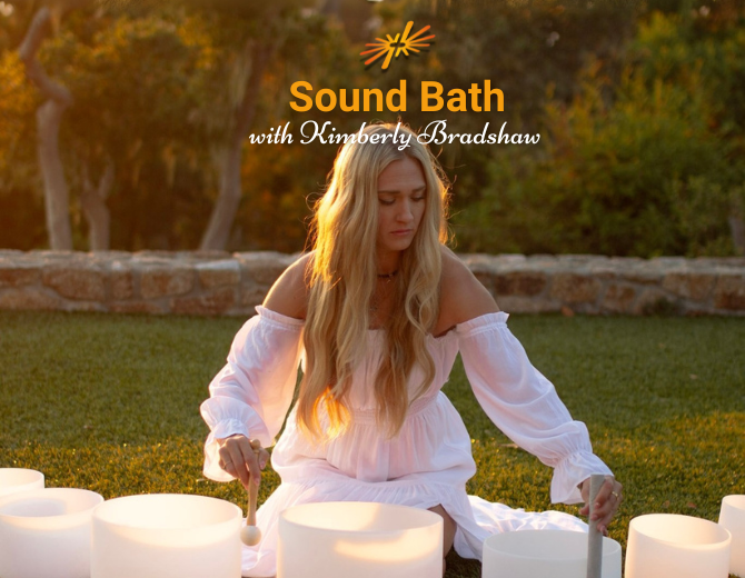 One Heart Collective set in front of a blurred image of a large group of people being guided through meditation.