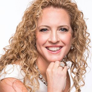 Michelle Jones smiling with her chin resting on her hand
