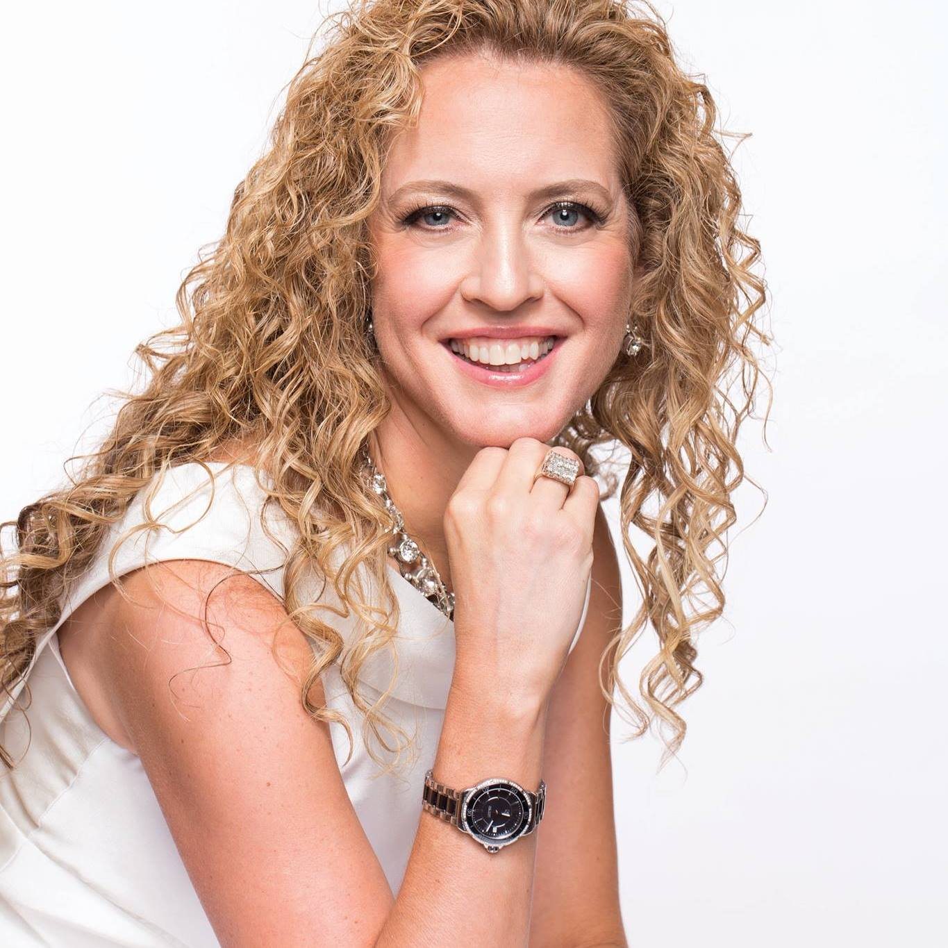 Michelle Jones smiling with her chin resting on her hand