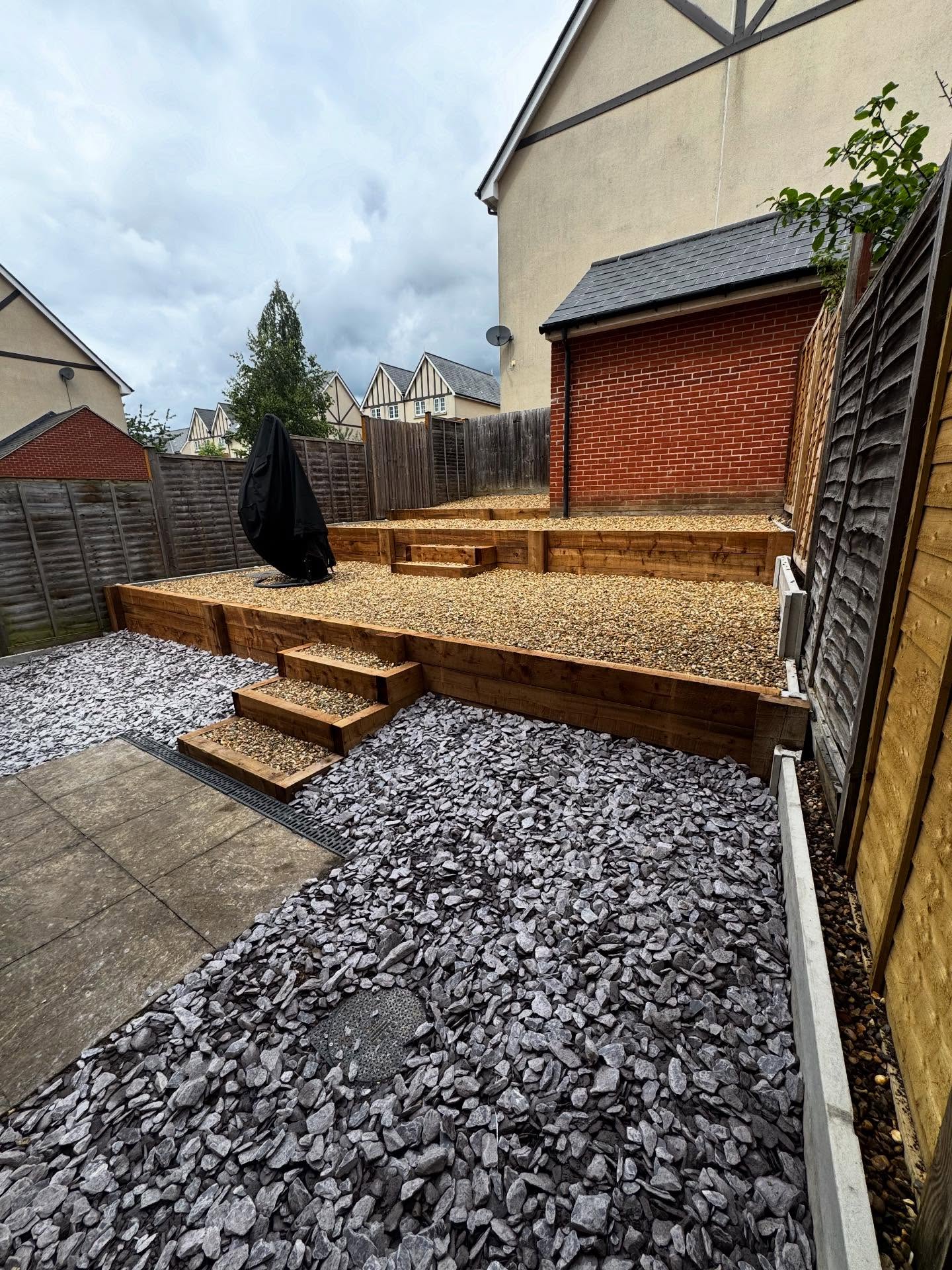 Gravel garden area finished against a new fence line