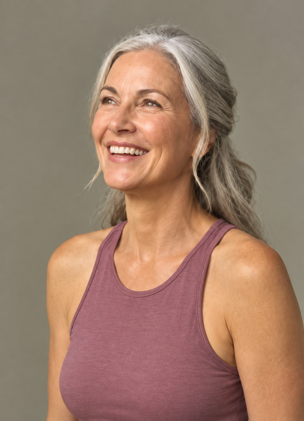 Woman smiling outdoors on a patio