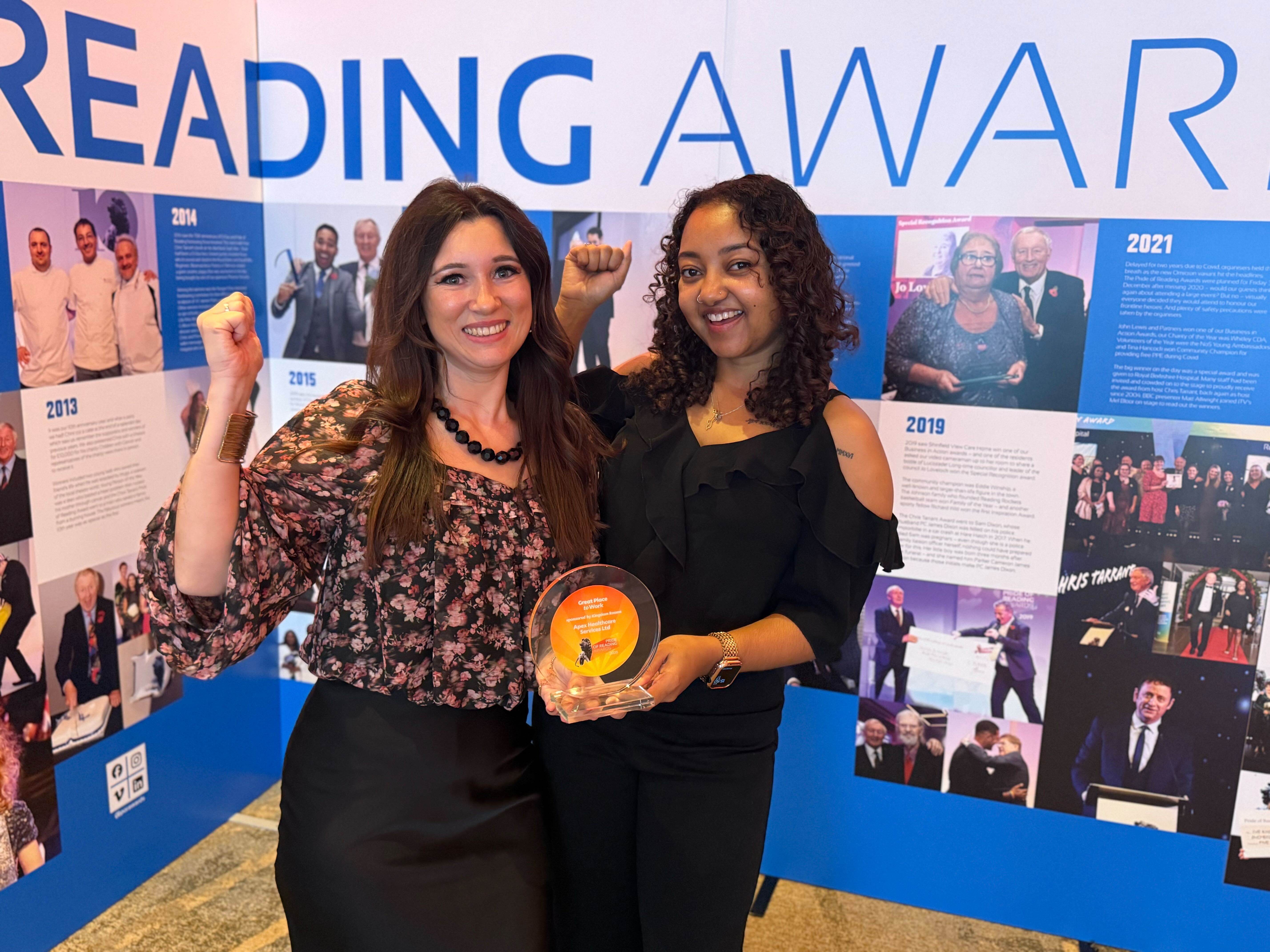 Apex team members proudly holding the Pride of Reading award