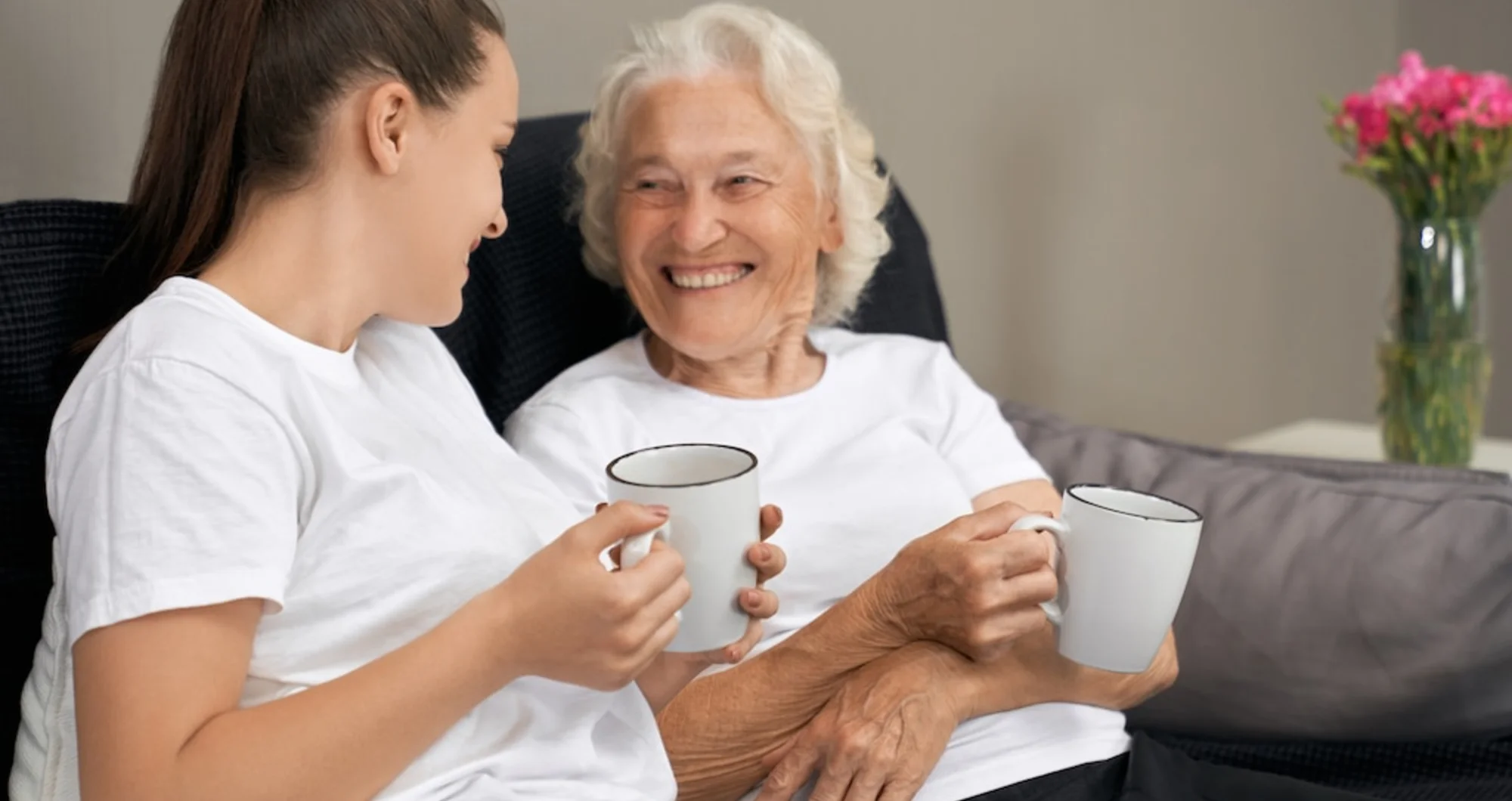 An Apex carer sitting and chatting with a client in their own front room in Reading