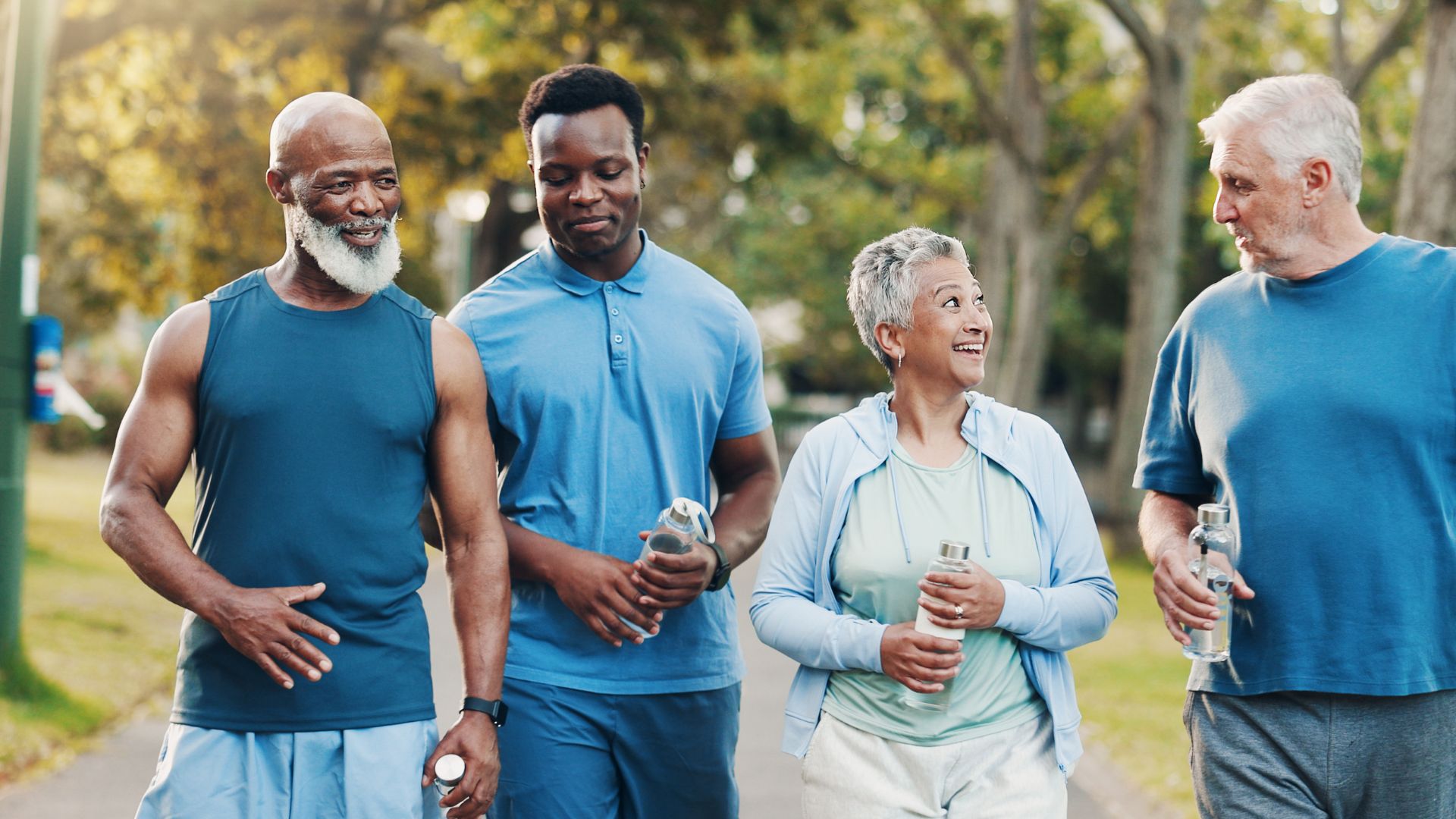 Active adults walking together outdoors after regaining mobility