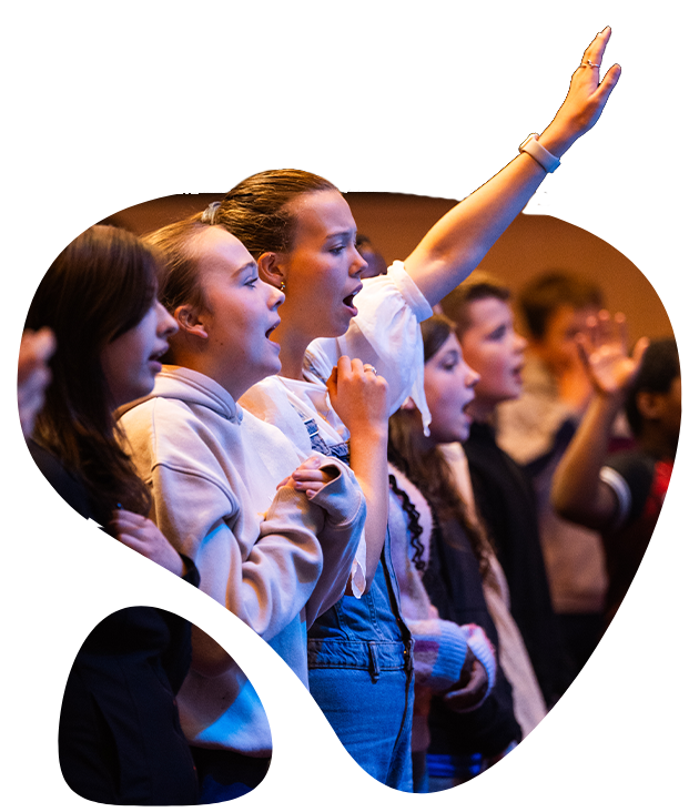 Young people worshipping together