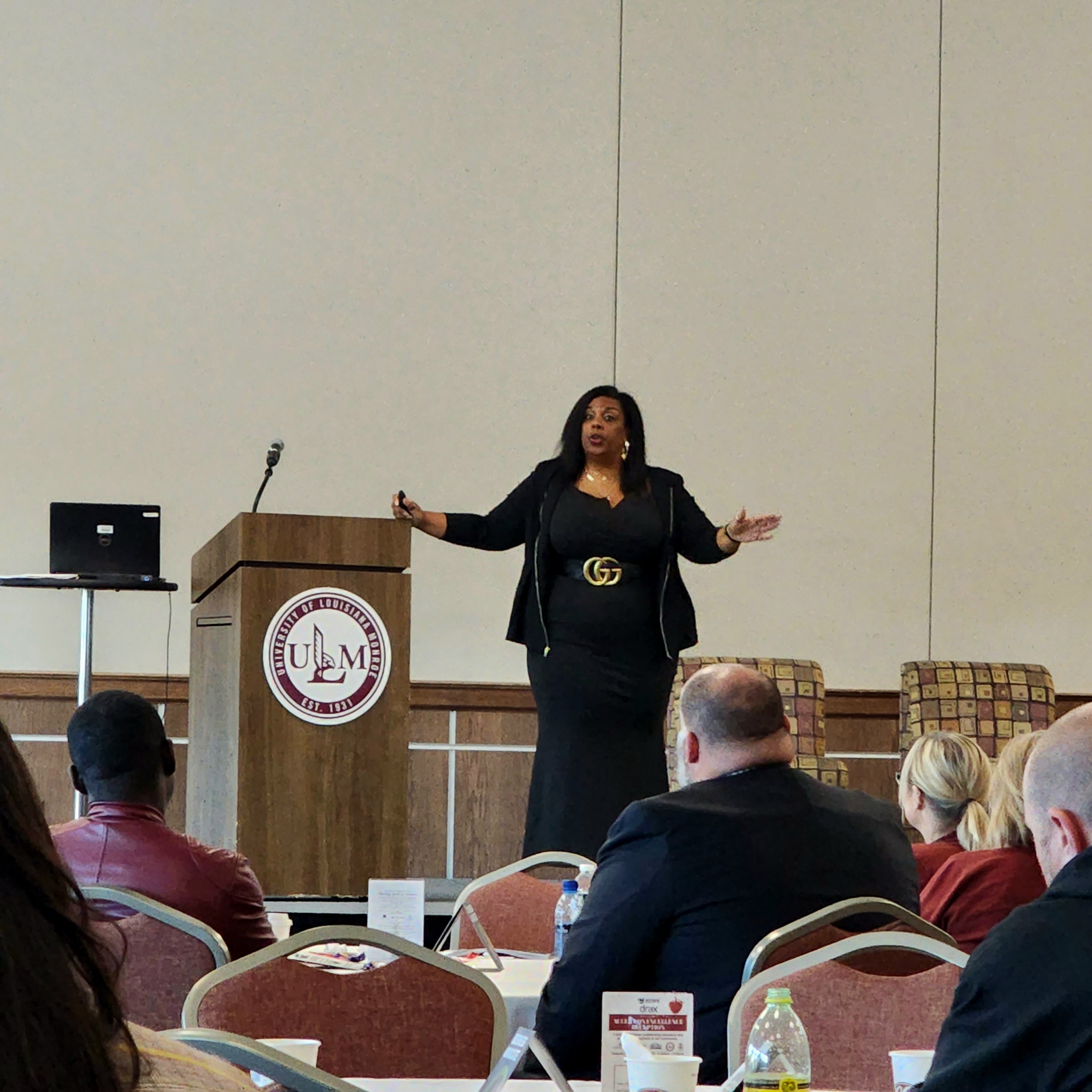 Ieshea Hollins hosting DT Cyber Games with an engaged audience raising hands