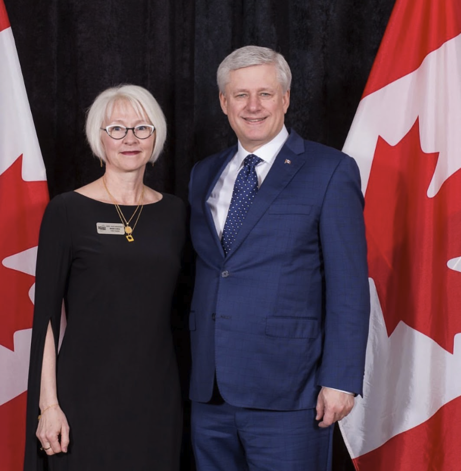 Nikki Csek with former Prime Minister Stephen Harper at Level Up
