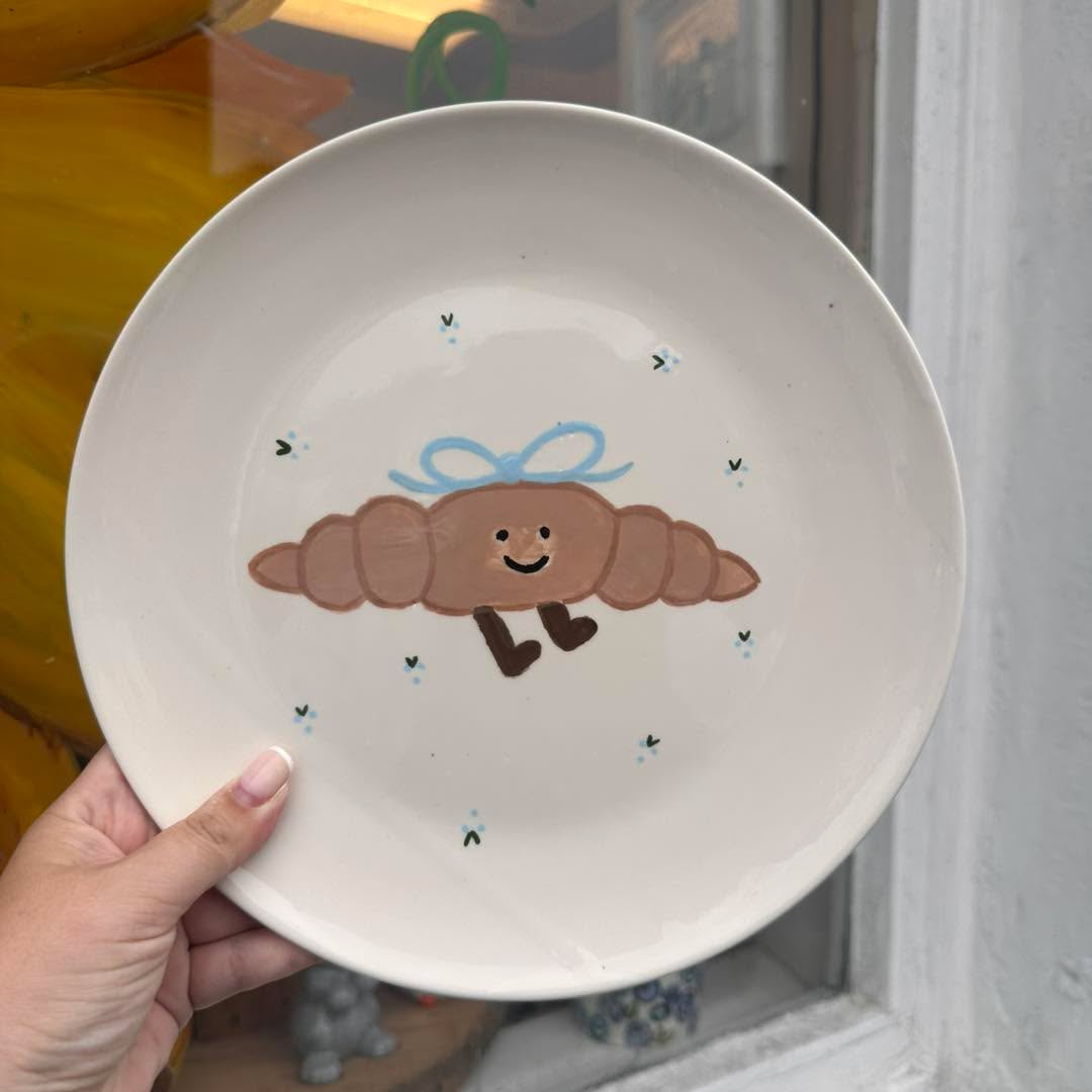 Painted pottery pieces on display at Puffin Pottery