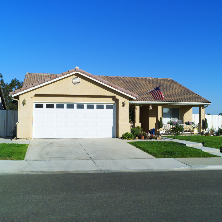 A charming single-story home with brick and stone exterior, highlighting family-friendly and cozy neighborhood living.