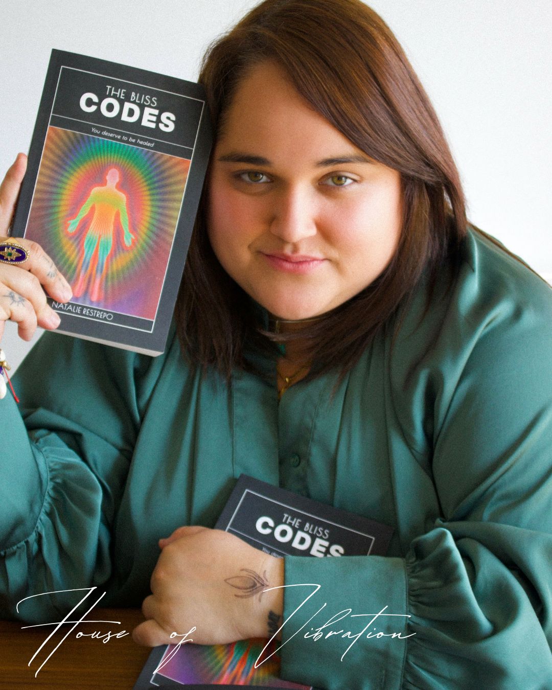 Natty holding The Bliss Codes