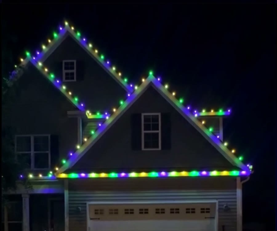 A two-story home with Omni C9 bulbs along every roofline