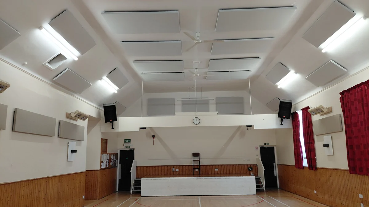 Rows of acoustic ceiling panels and upper-wall panels in Hatton of Fintray Village Hall.