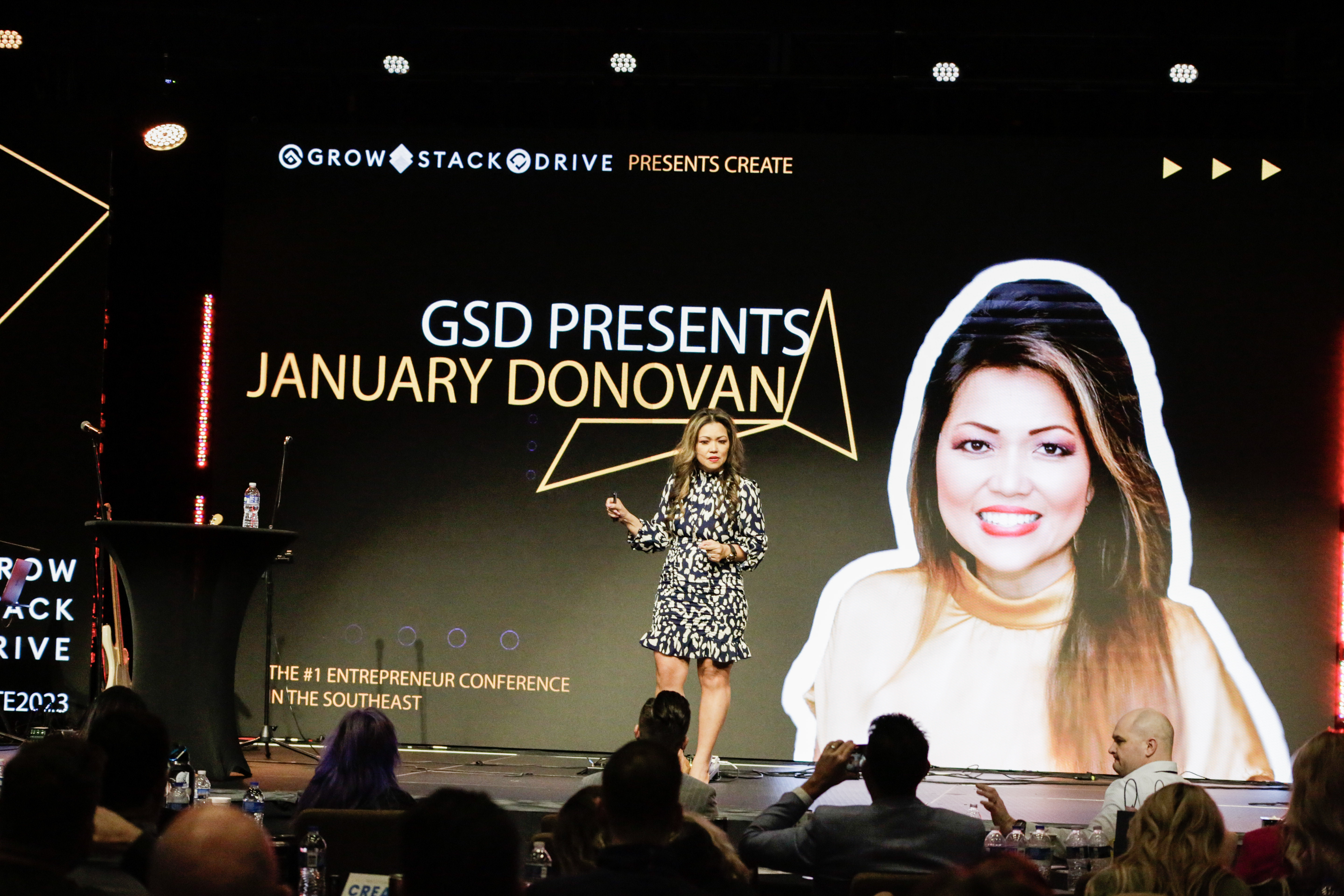 January Donovan speaking on stage
