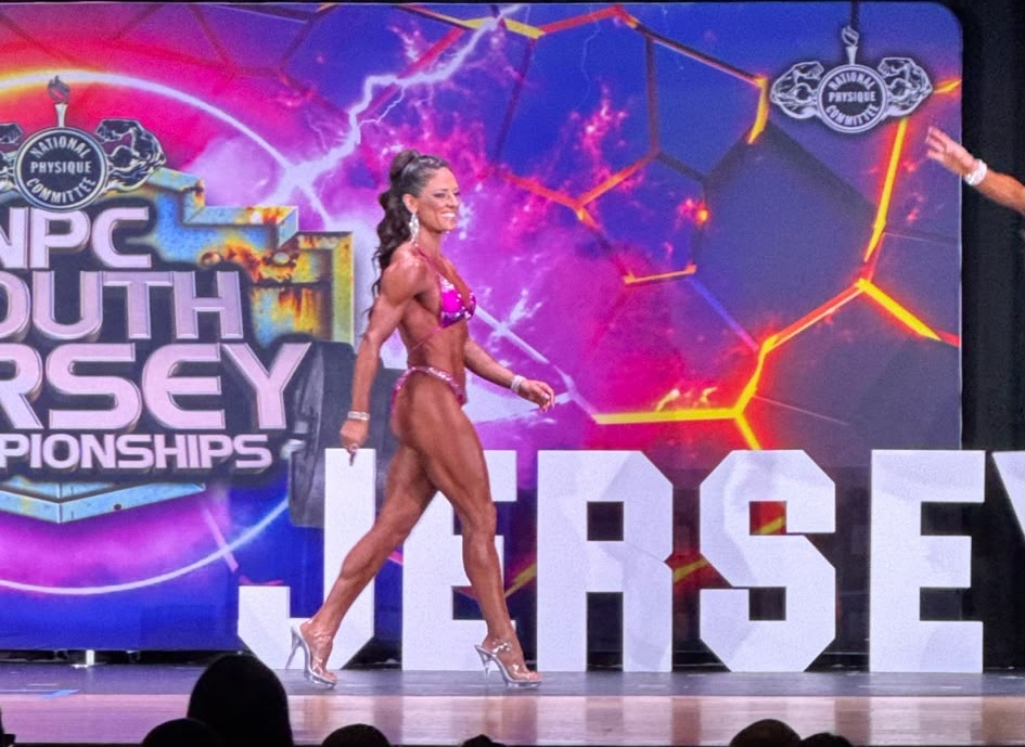 Female competitor walking the NPC South Jersey Championships stage