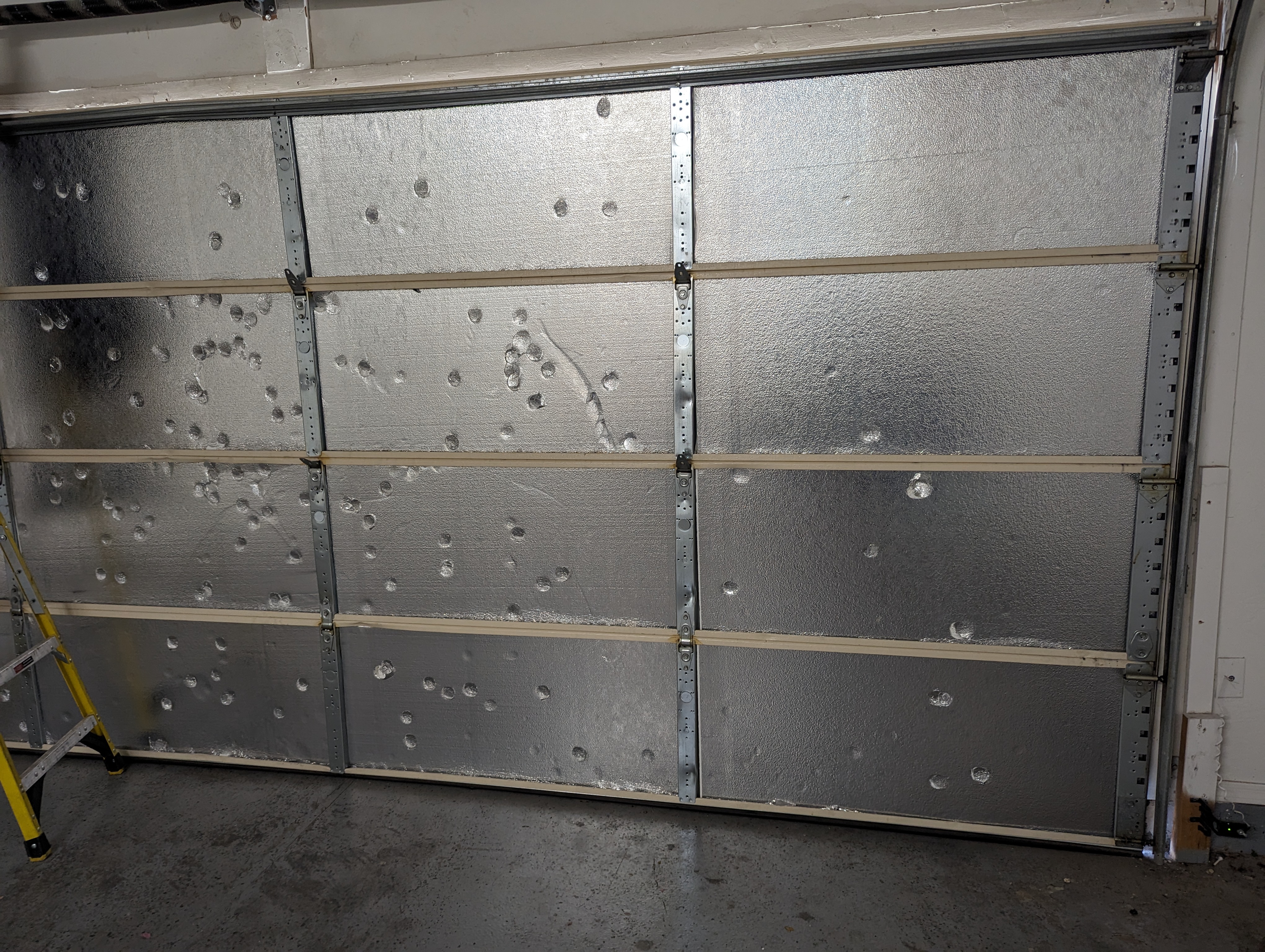 Garage door panel section replacement by Hinged Overhead Door